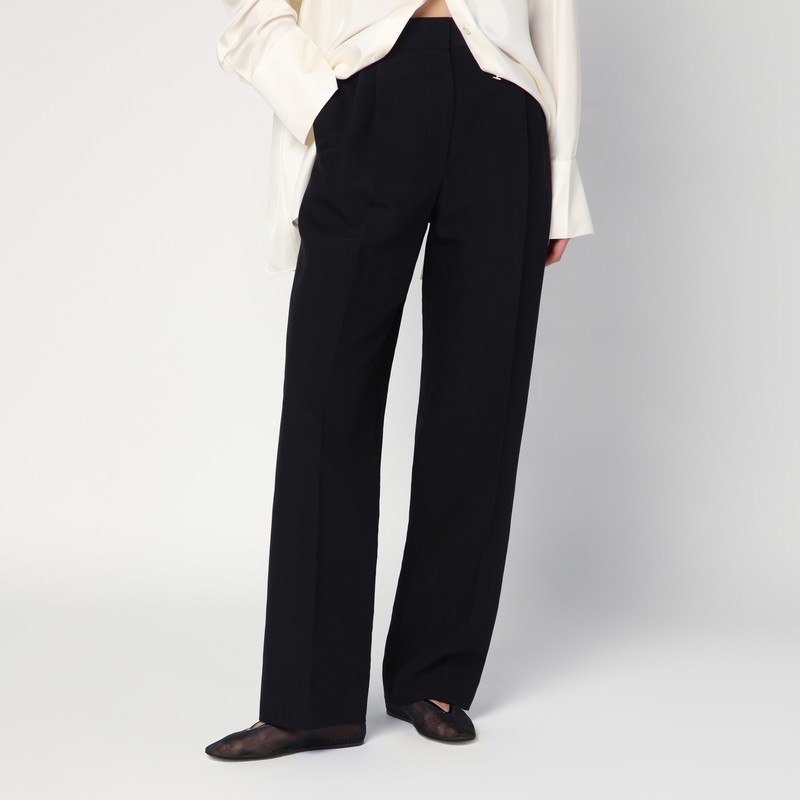 벨트 고리가 있는 높은 허리, 곧고 넓은 다리, 앞면 이중 주름, 지퍼와 후크가 있는 앞면 잠금 장치, 두 개의 측면 웰트 포켓 및 두 개의 뒷면 w가 특징인 Row 검정색 울 및 리넨 바지 이미지