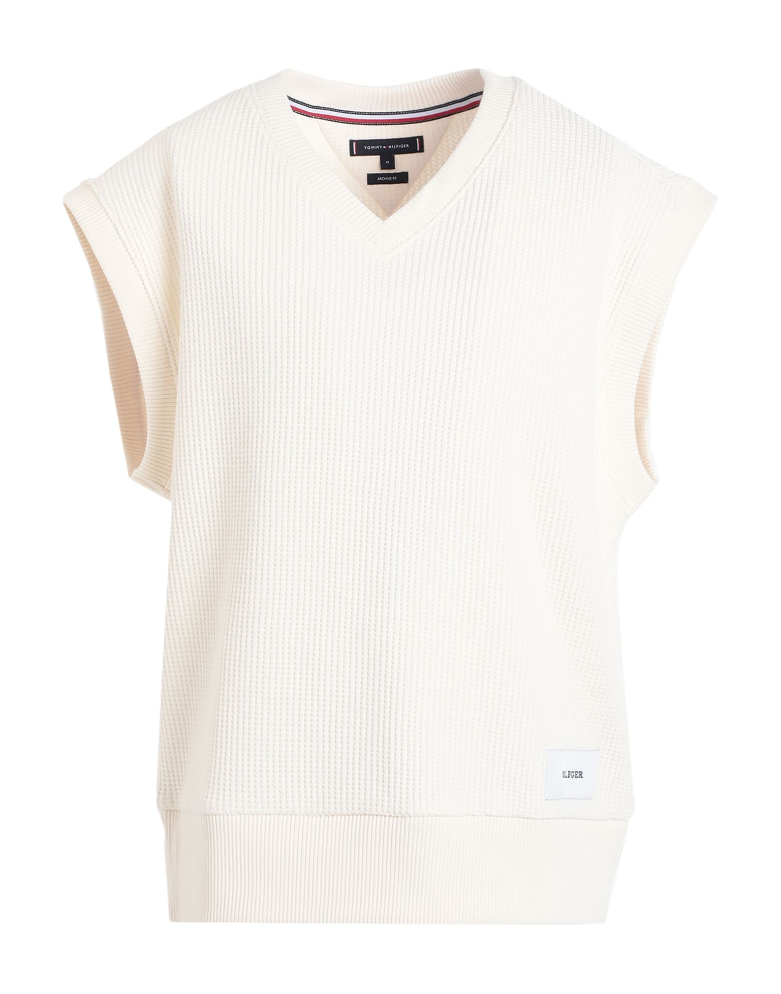 니트 소재, 허니콤, 라이트웨이트 니트, 브랜드 로고, 솔리드 컬러, v 네크라인, 슬리브리스, 포켓 없음, 라지 핏. 이미지