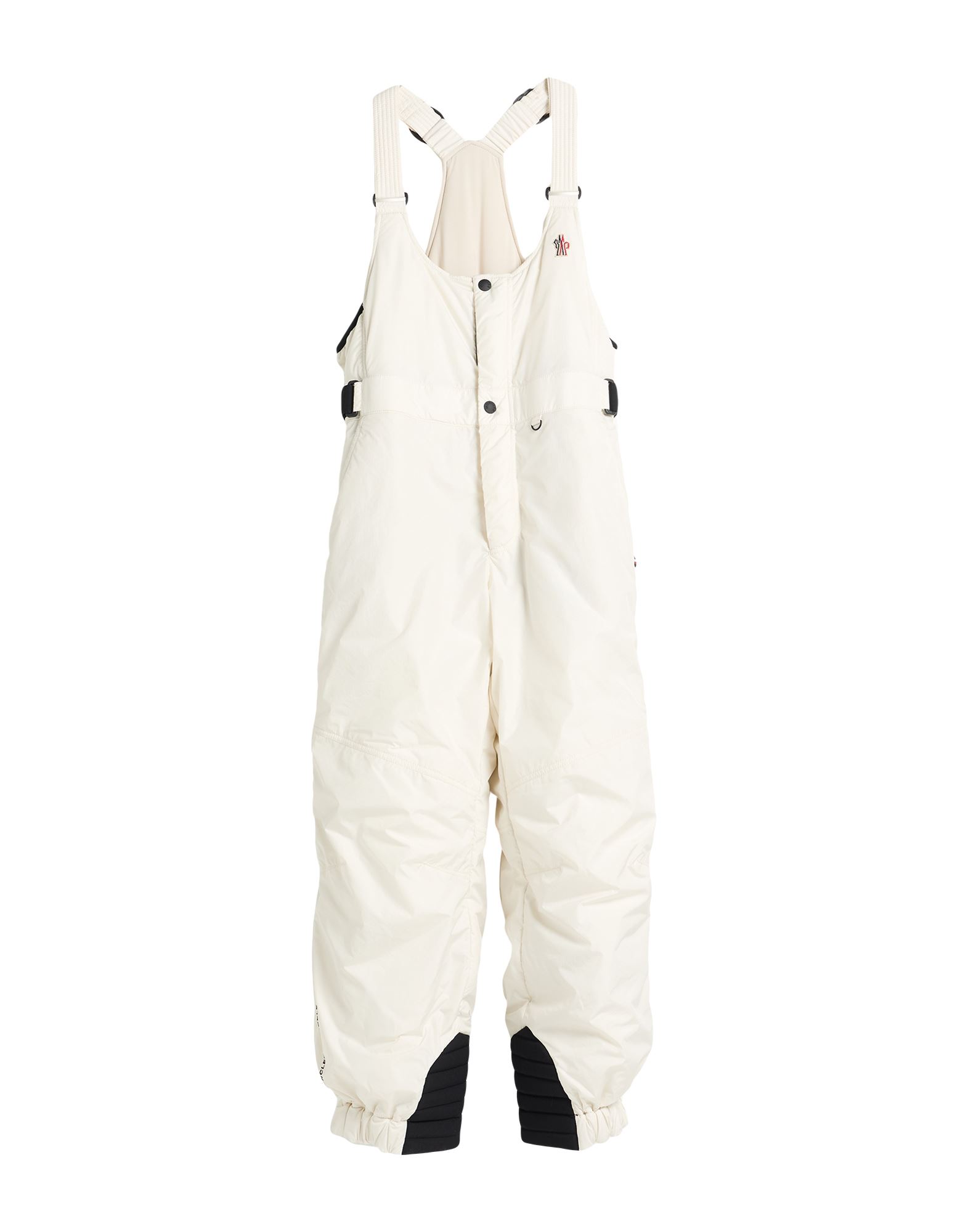 오버롤 스키복 세트, 테크니컬 패브릭, 솔리드 컬러, 브랜드 로고, 비브 오버롤 네크라인, 슬리브리스, 합성 충전재, 스냅버튼 여밈, 지퍼 여밈, 멀티 포켓, 세탁기 세탁 또는 드라이클리닝, 표백 금지, 건조기 사용불가, 눈 덮인 슬로프 안팎에서 활약하는, 스타일과 편안함을 모두 갖춘 퍼포먼스 스키웨어. 이미지