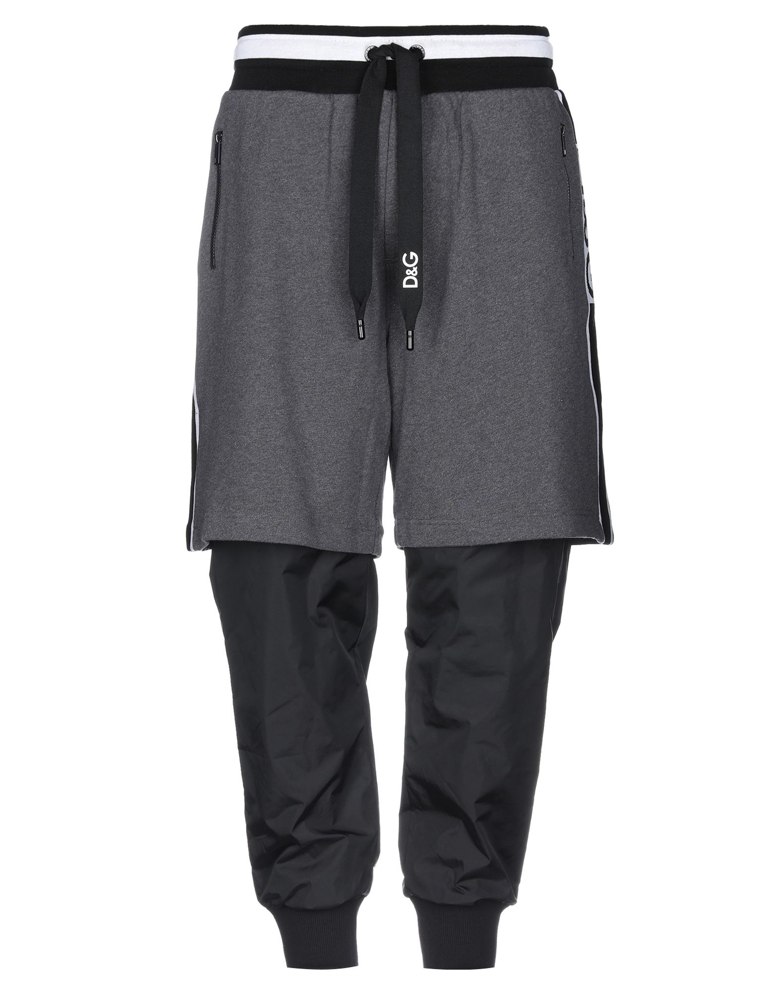 트랙 팬츠, 프렌치 테리, 테크니컬 패브릭, 투톤 패턴, 사이드 스트라이프, 브랜드 로고, 하이 웨이스트, 컴포트 핏, 드로스트링 여밈, 지퍼 포켓, 세탁기 세탁 또는 드라이클리닝, 표백 금지, 건조기 사용불가, 이 브랜드는 사이즈가 크게 나옵니다, 운동이나 야외 활동에 적합한, 스타일과 편안함을 모두 갖춘 퍼포먼스 스포츠웨어. 이미지