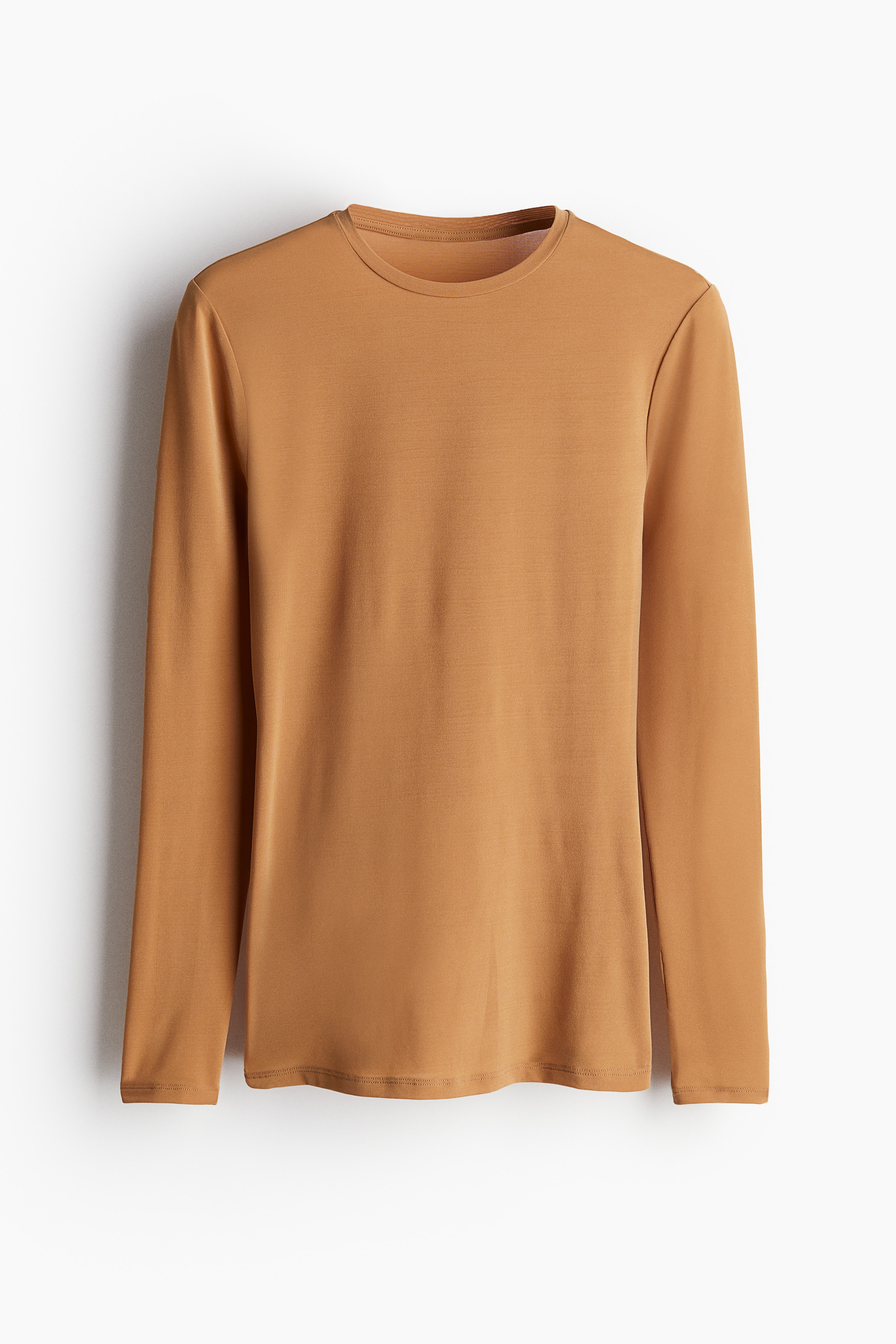 비침성 있는 저지 소재의 피트되는 탑. 라운드넥. 긴소매. 이미지