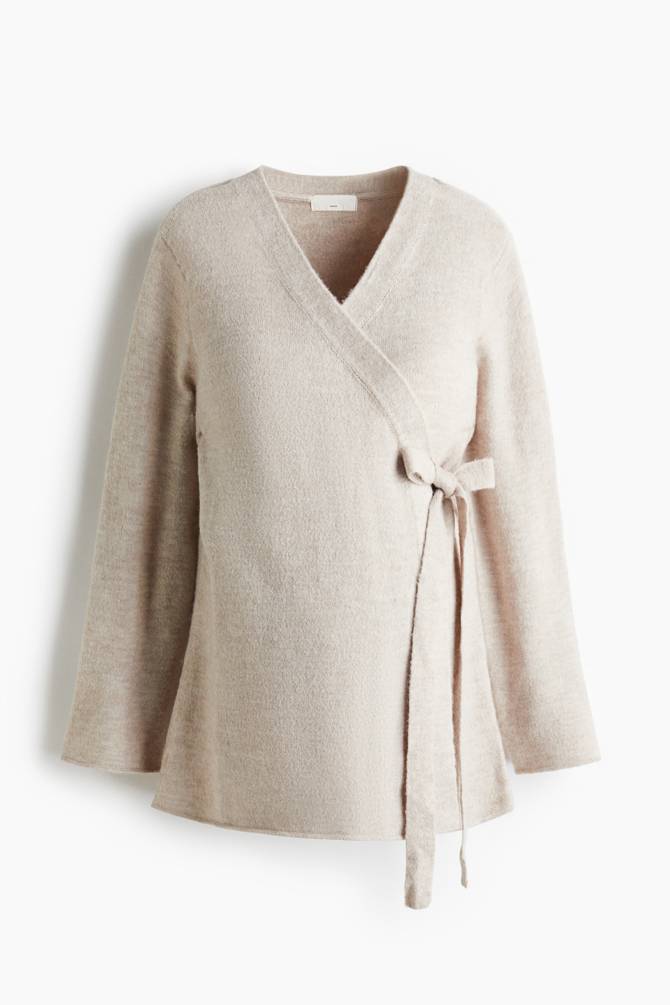 울을 함유한 부드러운 파인니트 소재의 가디건. 한쪽 옆면의 눈에 띄는 끈과 반대쪽 내부 끈을 묶어 여미는 랩스타일. 드롭 숄더. 골지 소맷단과 아랫단. 임신 중 및 출산 후 수유 시 모두 착용할 수 있음. 이미지