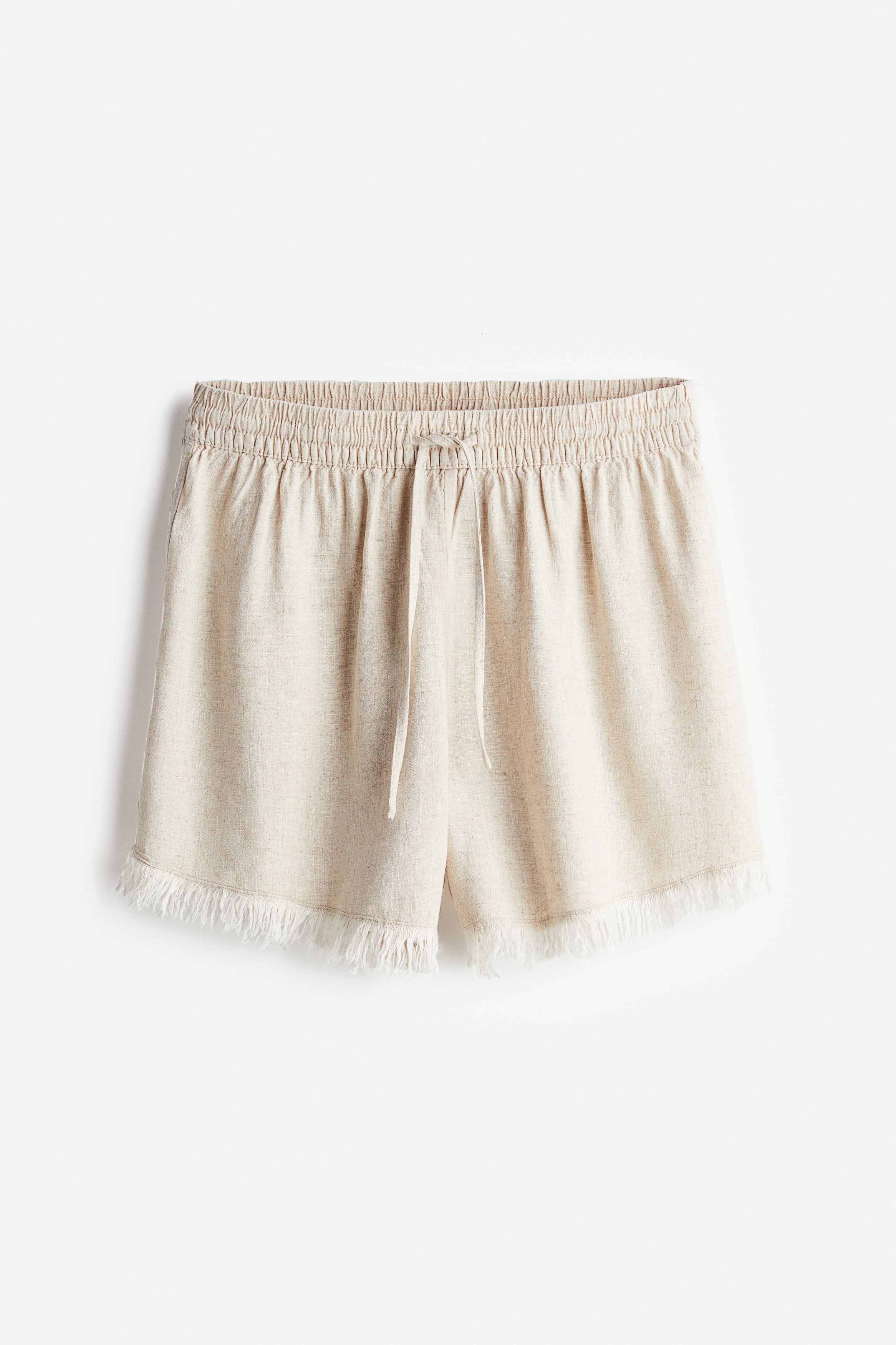 가벼운 리넨 혼방 비스코스 소재의 루즈핏 반바지. 올이 풀린듯 마감된 아랫단. 하이웨이스트. 드로스트링이 있는 신축성 허릿단. 이미지