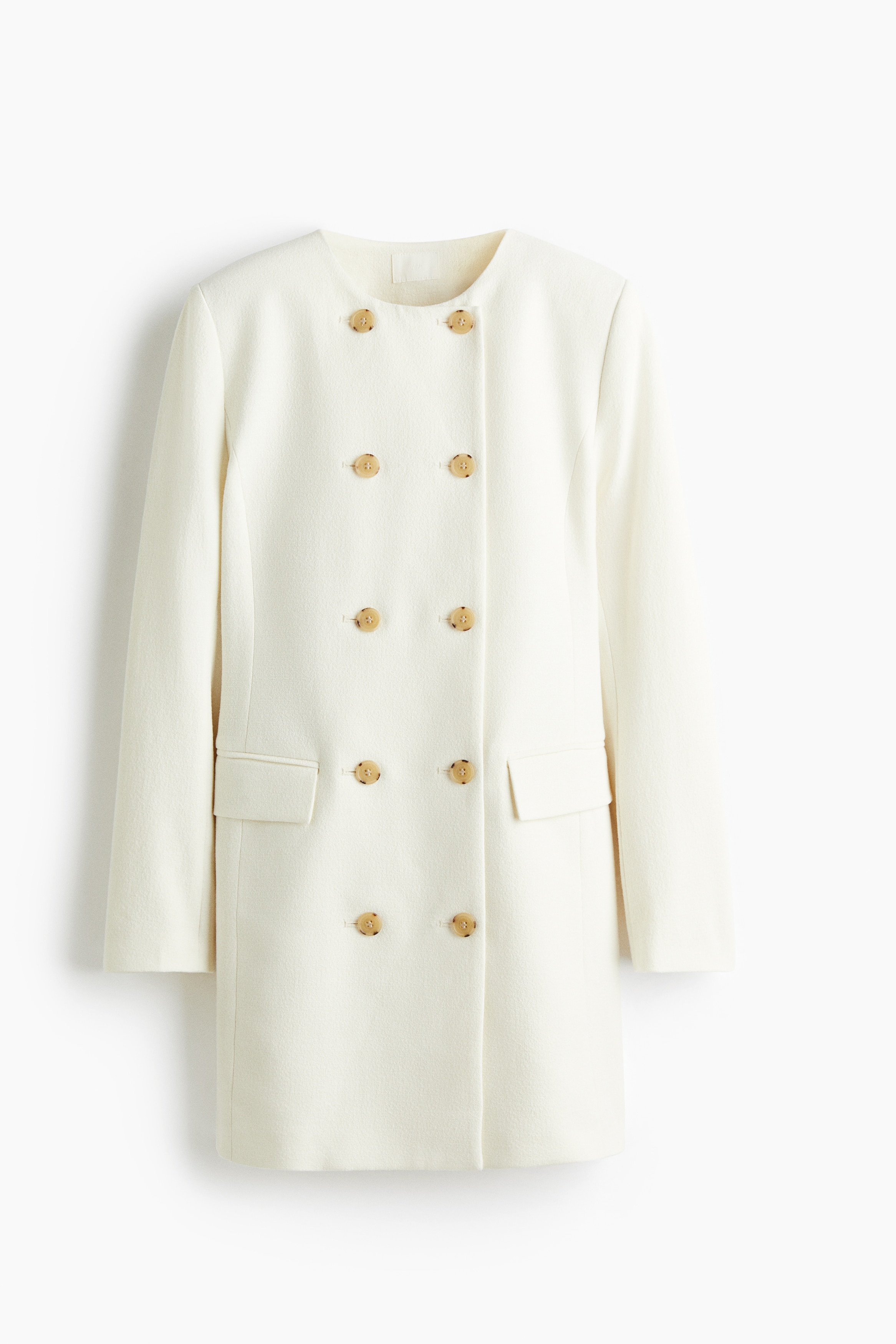 짧은 기장의 슬리브리스 재킷 드레스. 라운드넥. 앞면이 더블 브레스티드 스타일로 마감됨. 숄더 패드 내장. 플랩이 있는 앞면 웰트포켓. 안감 부착. 이미지