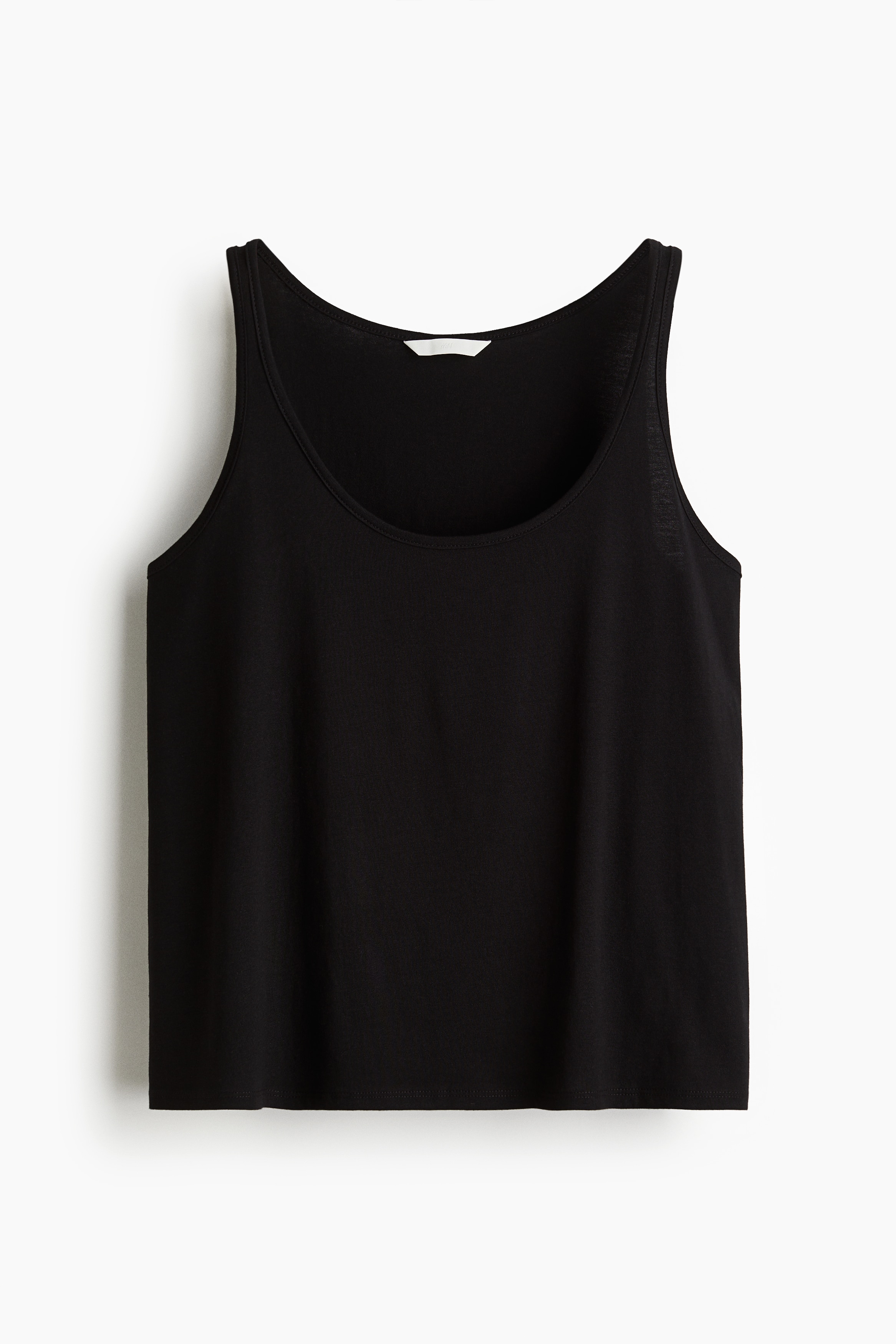 부드러운 코튼 저지 소재의 슬리브리스 스쿱넥 탑. 루즈핏. 스트레이트 헴라인. 이미지