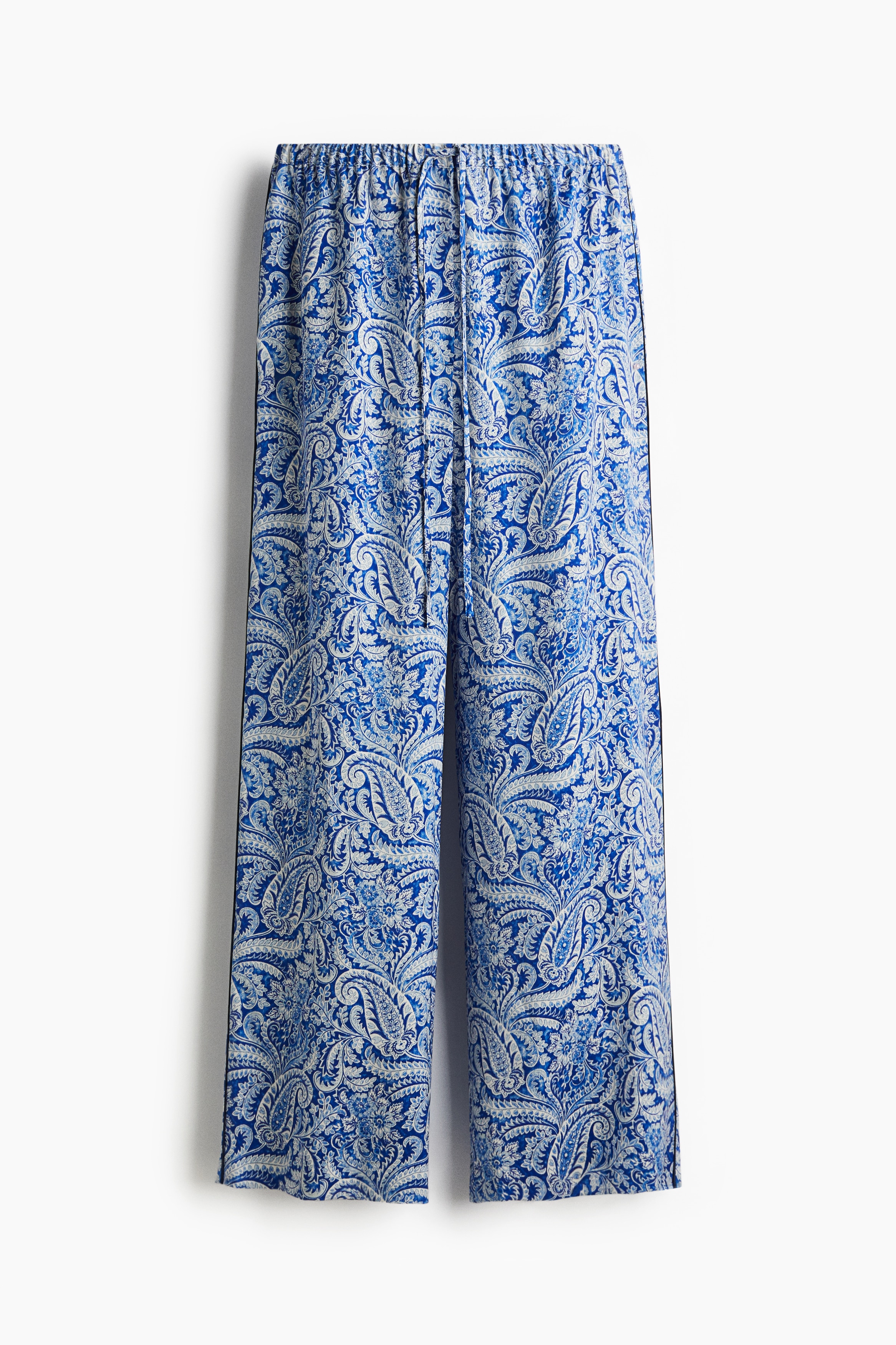 드로스트링이 있는 신축성 허릿단의 루즈핏 팬츠. 페이크 플라이. 옆면에 파이핑 디테일이 있는 스트레이트 레그. 이미지