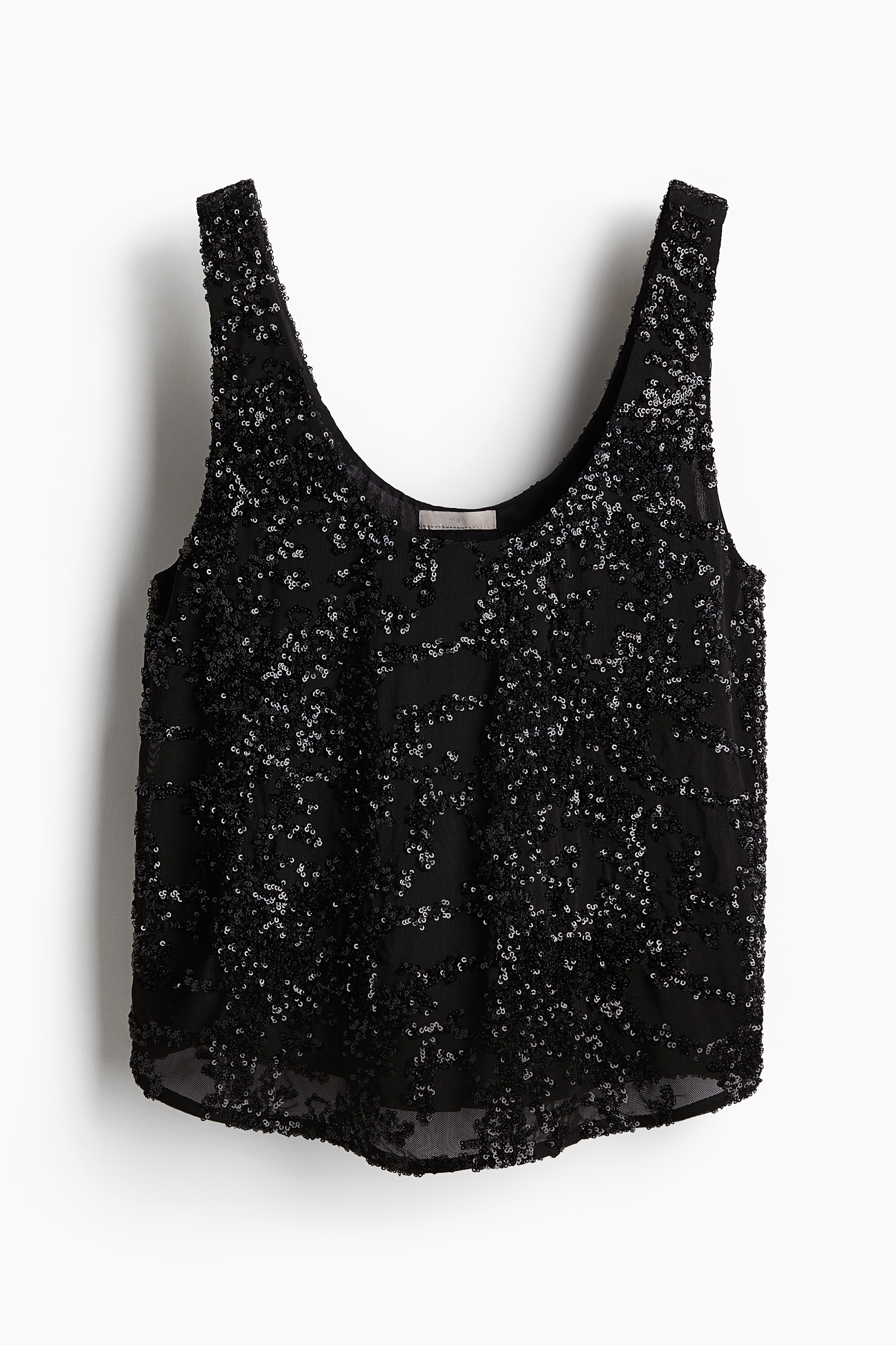 시퀸으로 커버된 메쉬 소재의 슬리브리스 탑. 와이드한 어깨 스트랩. 앞뒷면이 스쿱넥으로 마감됨. 저지 안감 부착. 이미지