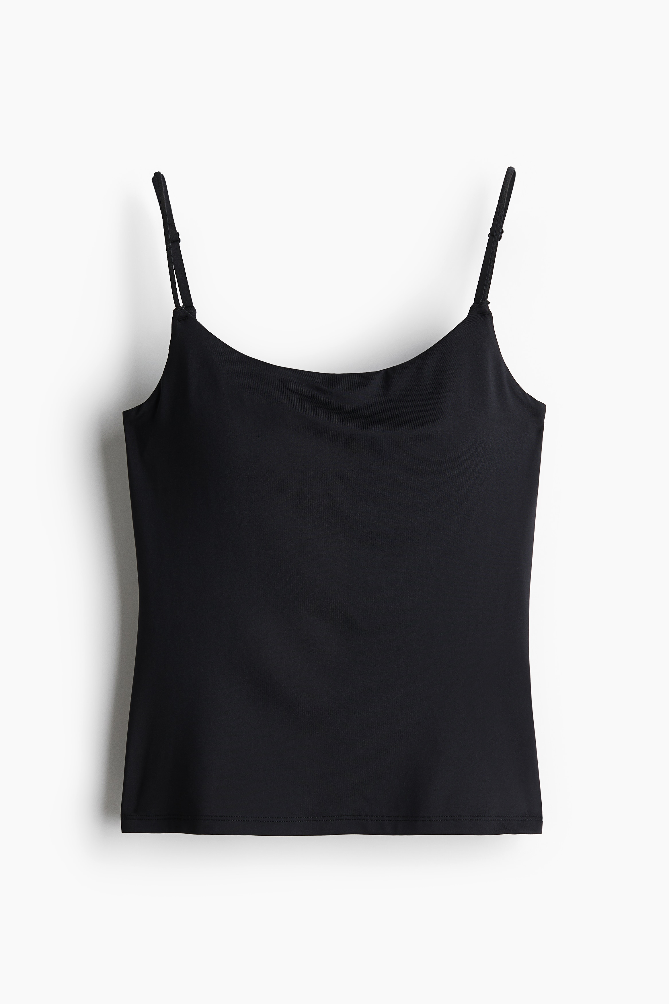 부드러운 저지 소재의 피트되는 탑. 길이 조절 가능한 가는 어깨 스트랩. 아랫단이 밴딩처리된 패드컵 브라 내장. 수분 흡수와 온도 조절을 효율적으로 돕는 퀵드라이 폴리에스터를 사용해 부드럽고 편안한 기능성 COOLMAX® 소재. 이미지