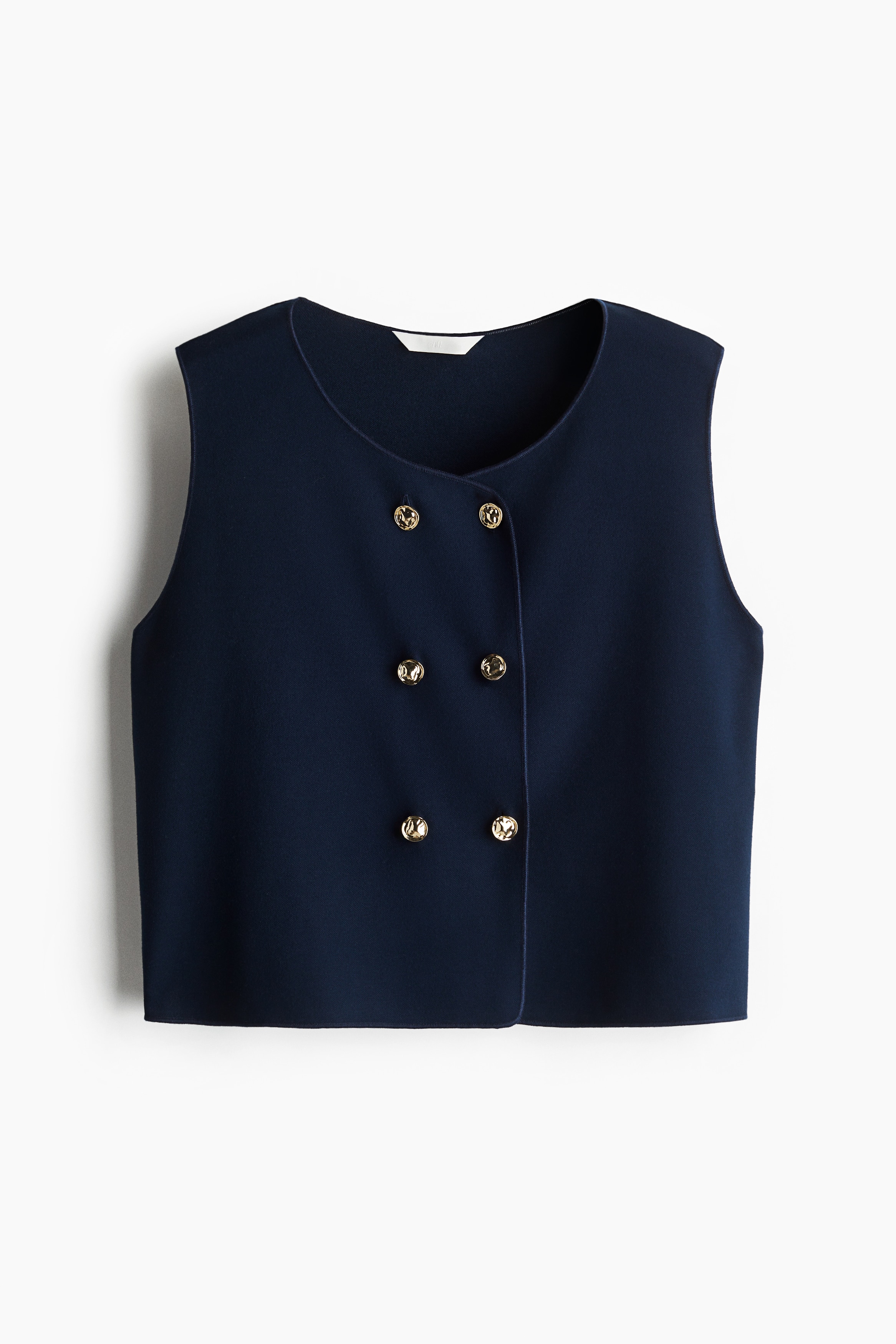 촘촘한 저지 소재의 짧고 피트되는 베스트. 오버로크처리된 옷단. 라운드넥. 장식 디테일이 있는 금속 버튼을 사용한 더블 브레스티드 스타일. 이미지1