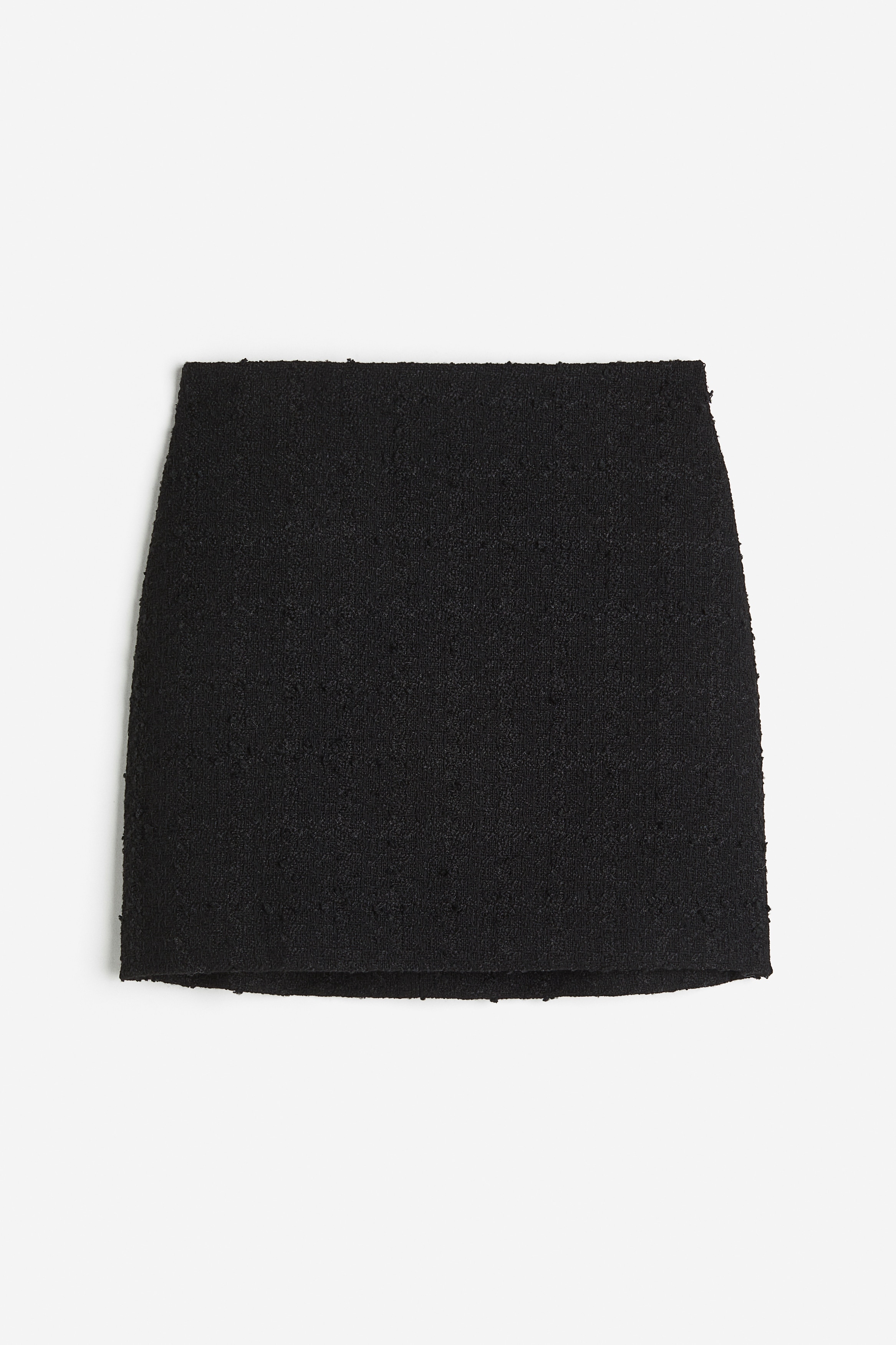 텍스처가 있는 우븐 소재의 피트되는 미니 스커트. 하이웨이스트. 밴딩이 내장된 허릿단. 뒷면 히든 지퍼와 버튼 클로징. 안감 부착. 이미지