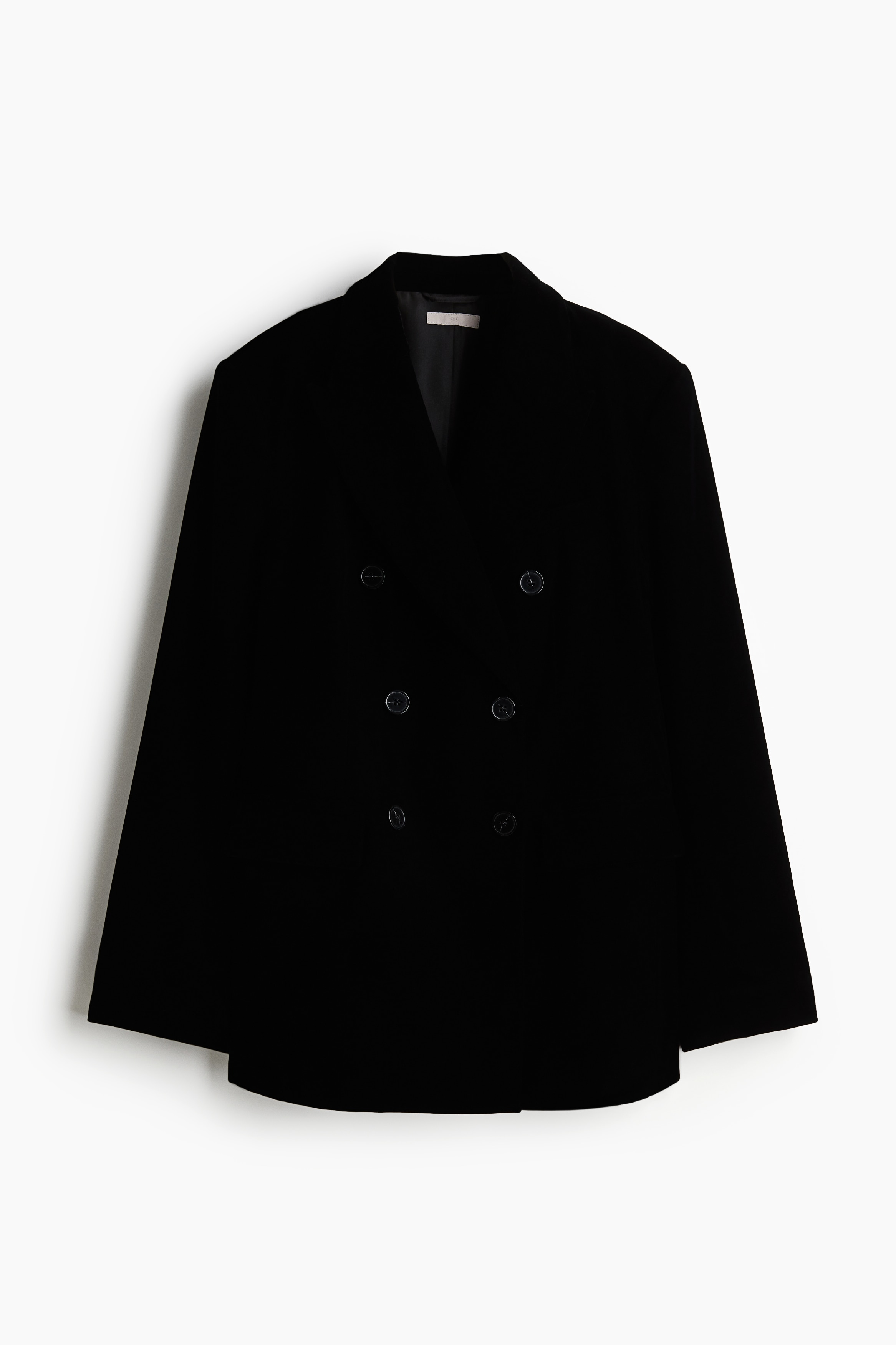 부드러운 벨벳 소재의 롱 재킷. 피크트 라펠. 버튼으로 여미는 더블 브레스티드 스타일. 가슴 웰트포켓. 플랩이 있는 앞면 하단 웰트포켓. 얇은 숄더 패드 내장. 소맷단 버튼 장식. 뒷트임. 안감 부착. 이미지