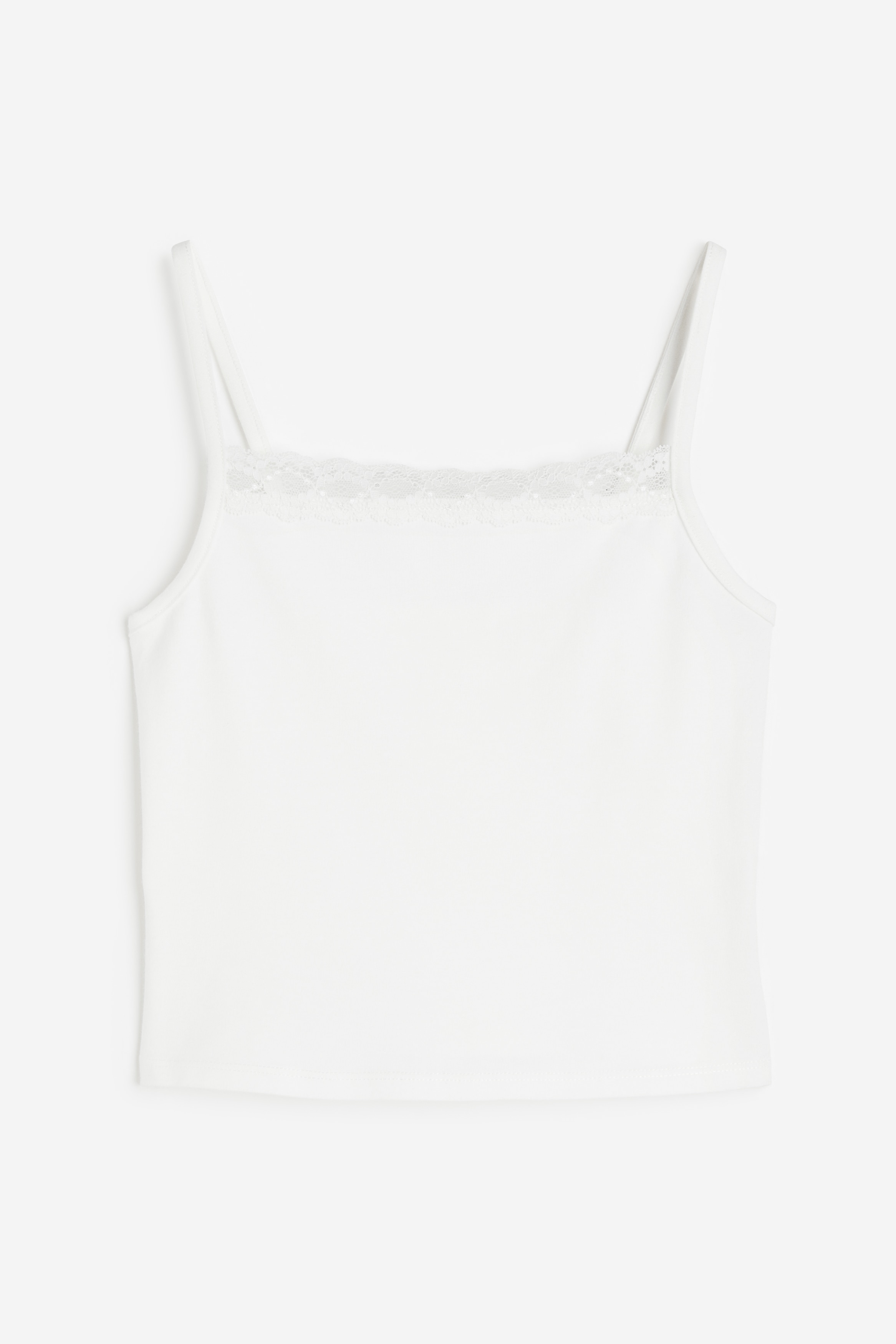 부드러운 코튼 저지 소재의 스트랩 탑. 가느다란 어깨 스트랩. 레이스로 트리밍된 스퀘어넥. 이미지