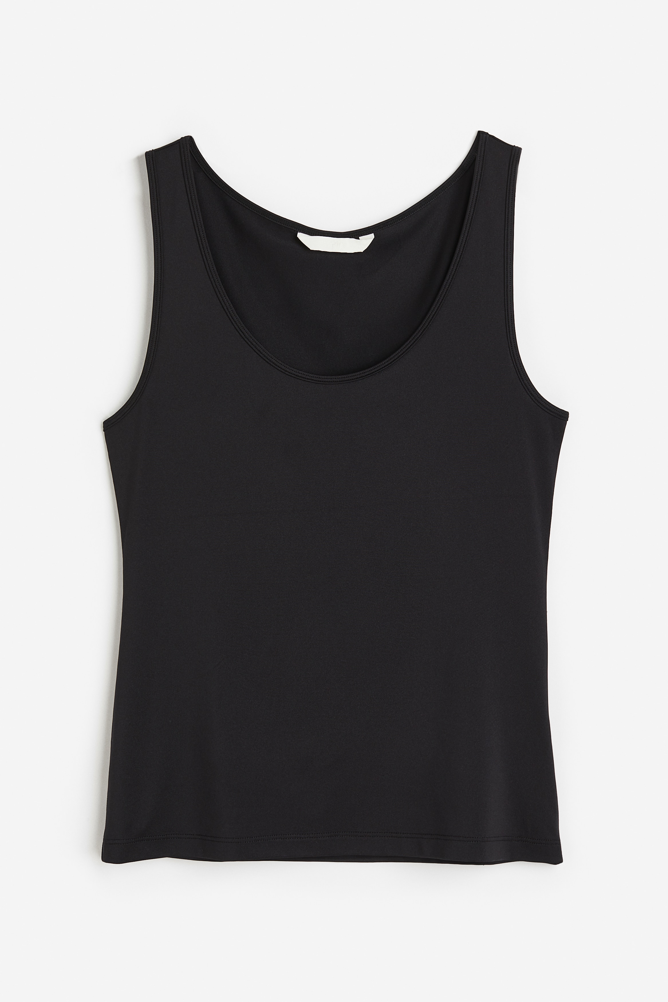 스트레치 저지 소재의 슬리브리스 탑. 깊에 파인 라운드넥. 수분 흡수와 온도 조절을 효율적으로 돕는 퀵드라이 폴리에스터를 사용해 부드럽고 편안한 기능성 COOLMAX® 소재. 이미지