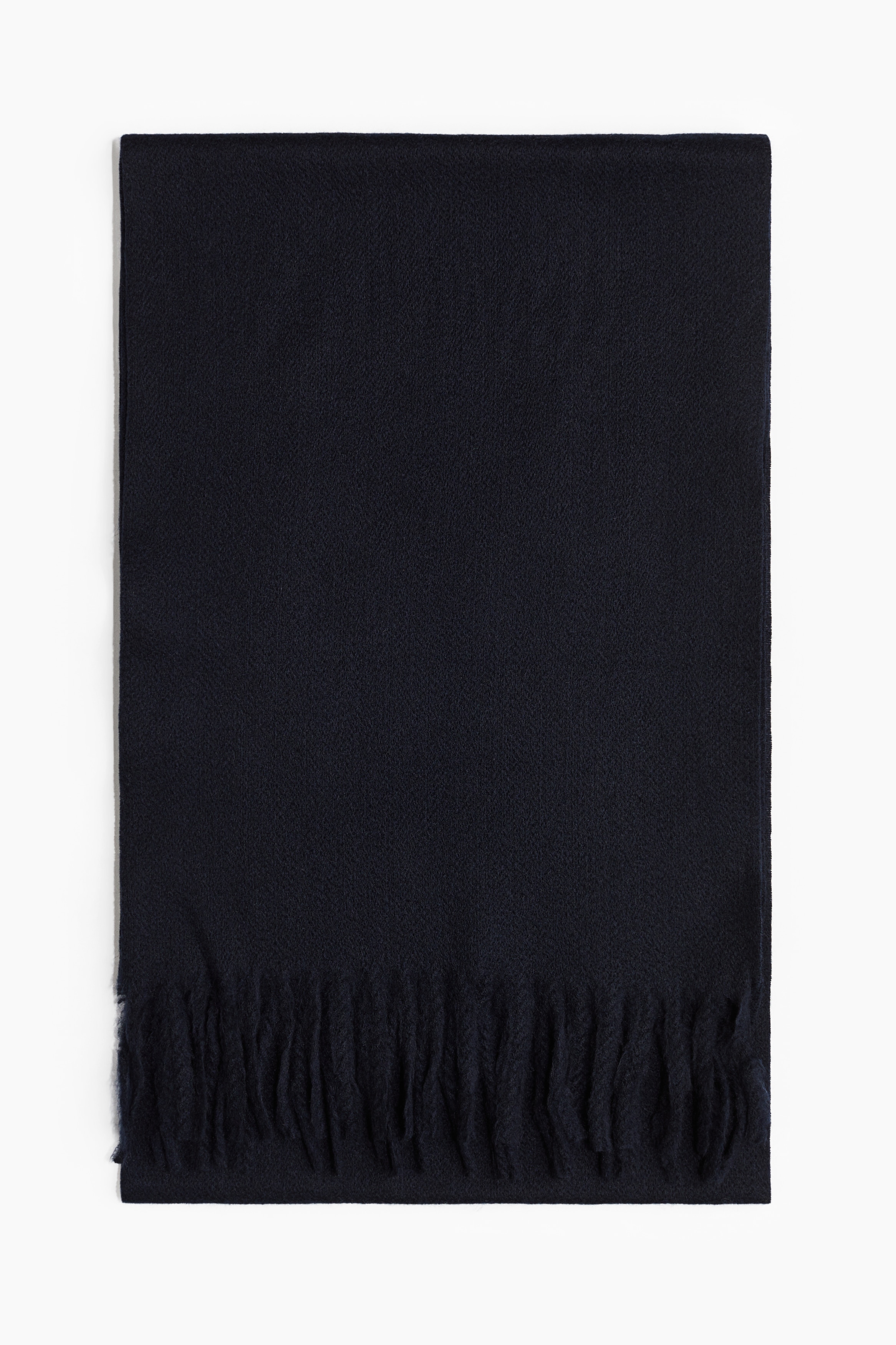 울을 함유한 부드러운 우븐 소재의 머플러. 양쪽 끝이 프린지로 장식됨. 이미지