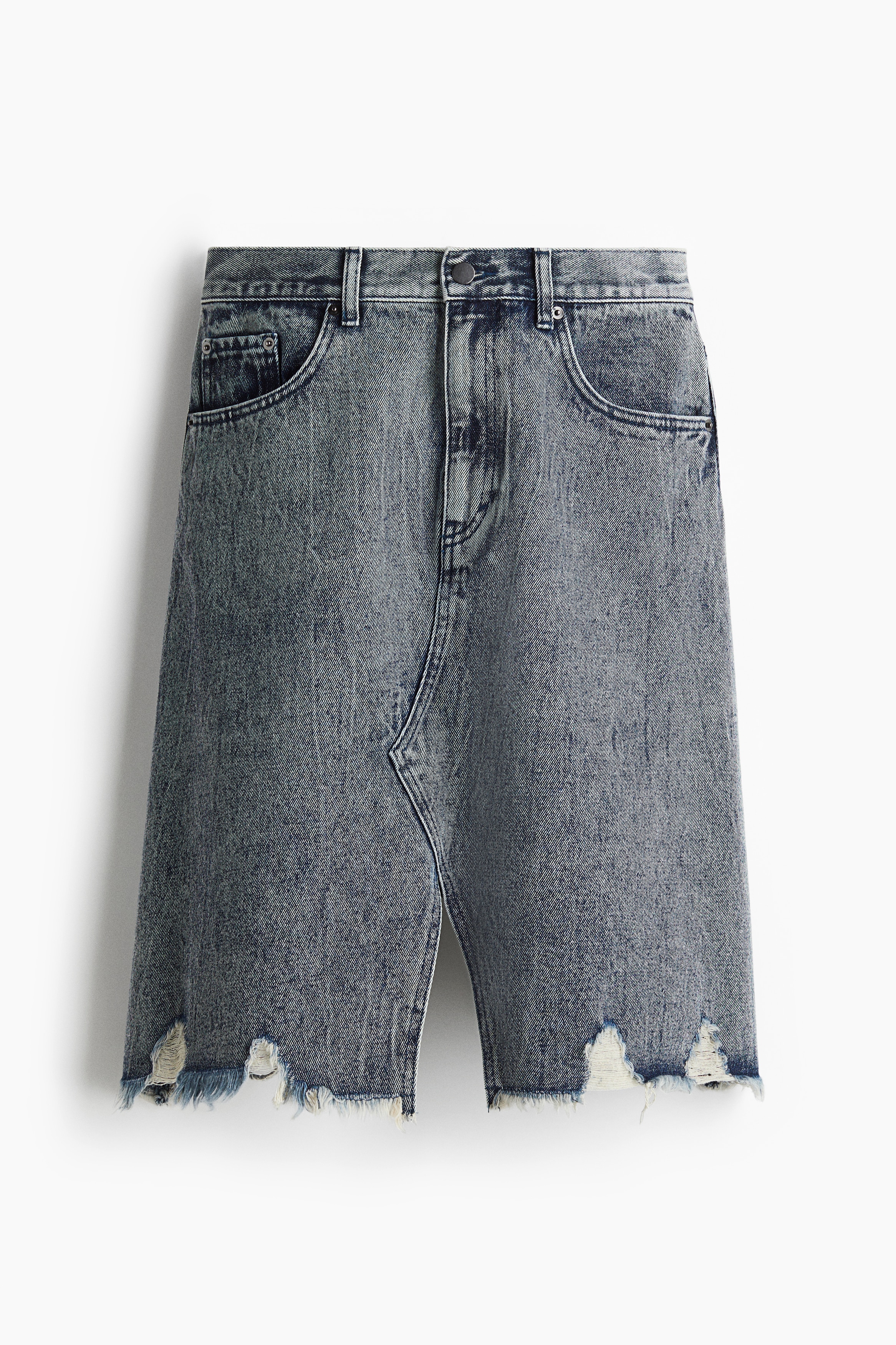 디스트레스드 디테일이 있는 톡톡한 코튼 데님 소재의 5포켓 니렝스 스커트. 플레어 스타일. 안쪽 솔기가 랩스타일로 마감되었으며, 앞뒷면에 와이드한 트임이 있는 반바지 느낌의 디자인. 지퍼와 버튼 클로저. 이미지