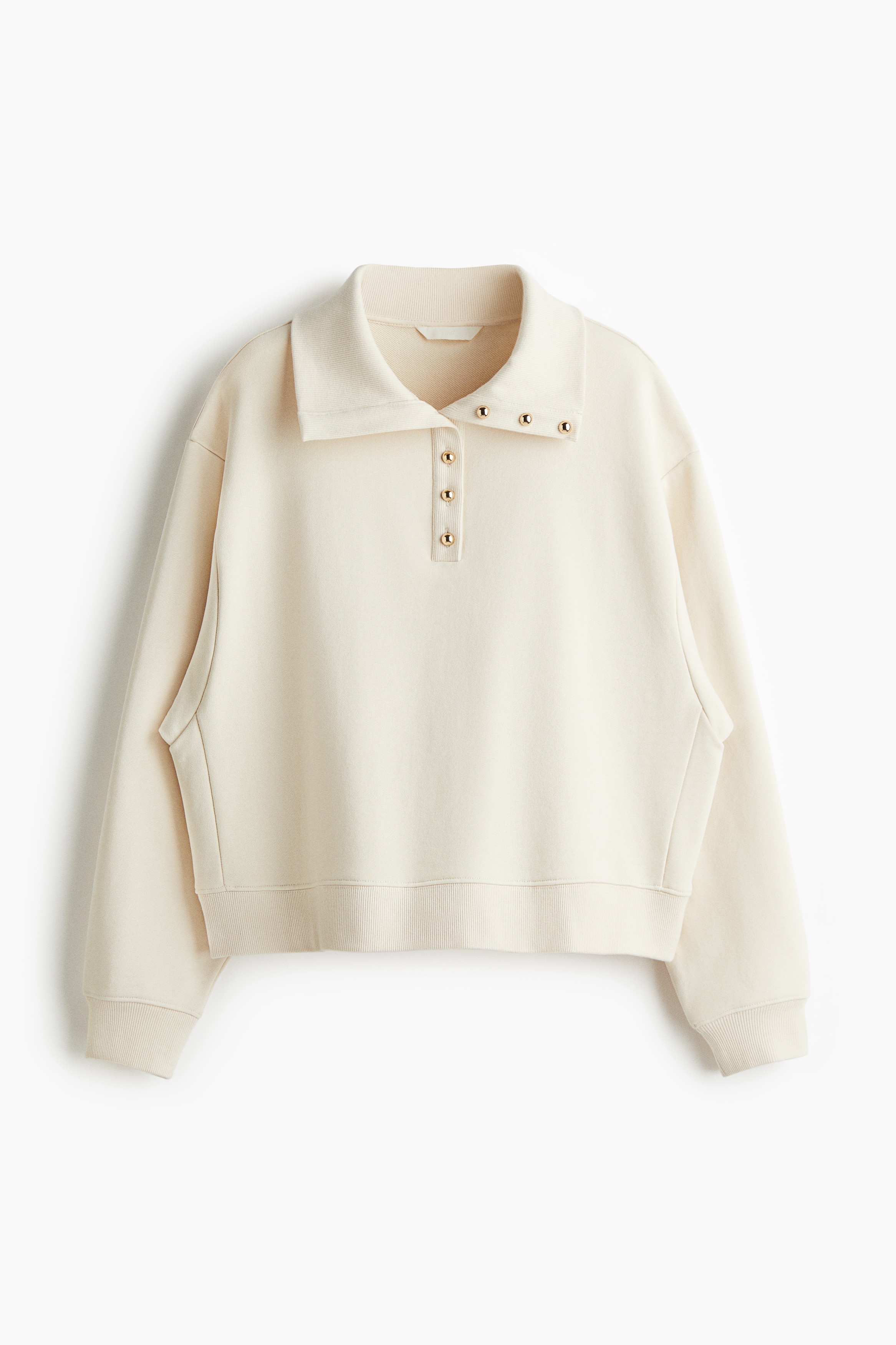 Loose-fit top in lightweight cotton sweatshirt fabric with a collar and domed metal buttons at the top. Dropped shoulders, long sleeves and ribbing at the cuffs and hem. 이미지1
