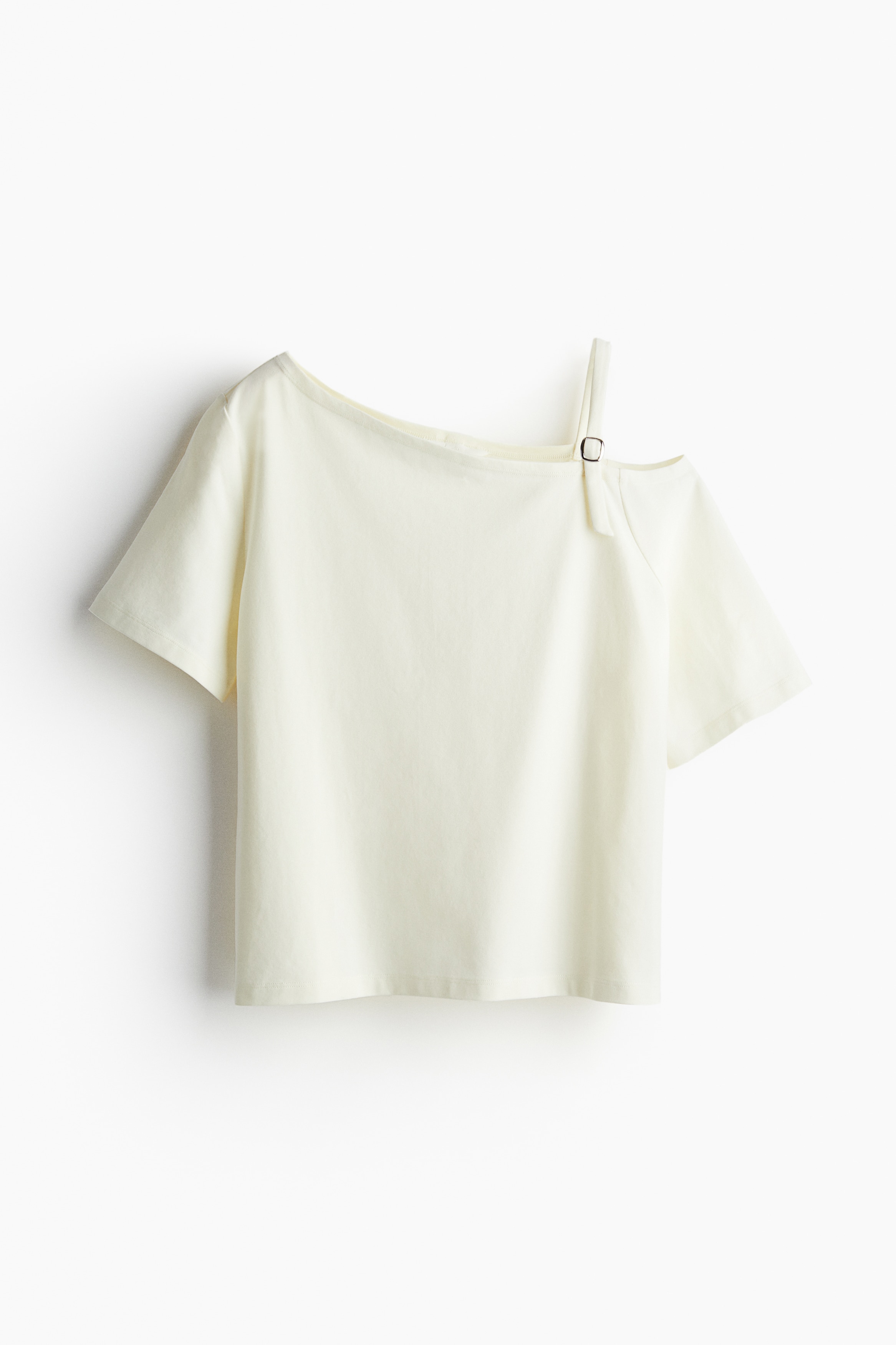 코튼 저지 소재의 티셔츠. 언발란스 네크라인. 어깨 한쪽이 드러난 원숄더 디자인. 가느다란 어깨 스트랩 길이를 조절할 수 있음. 이미지