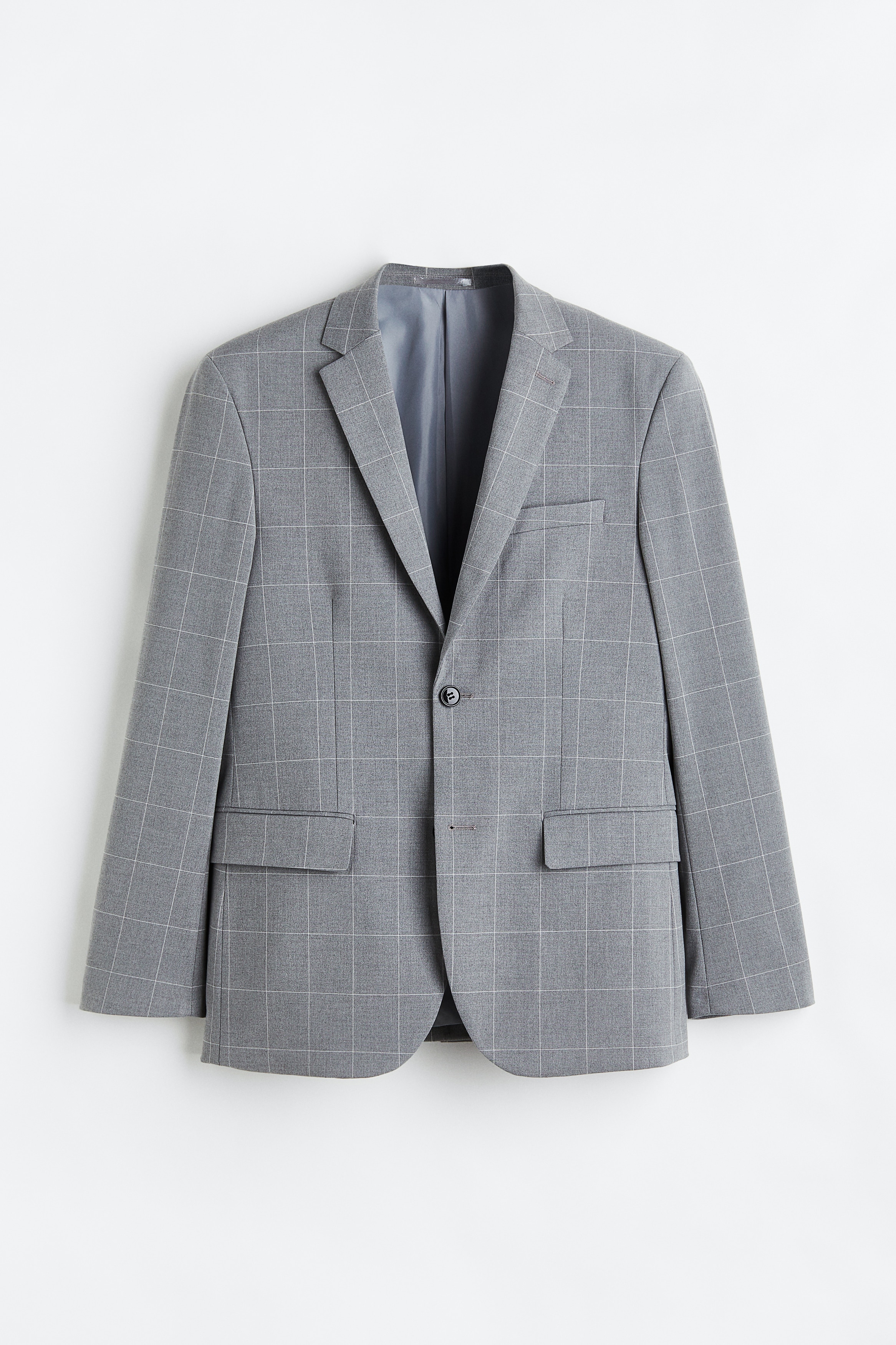 스트레치 소재의 싱글 브레스티드 재킷. 폭이 좁은 노치트 라펠. 버튼홀 디테일. 가슴 포켓, 앞면 하단 플랩포켓. 내부 포켓 1개. 투버튼 스타일. 소맷단 버튼 장식. 뒷트임. 바디 라인을 감싸며 피트되는 슬림핏 실루엣. 안감 부착. 이미지