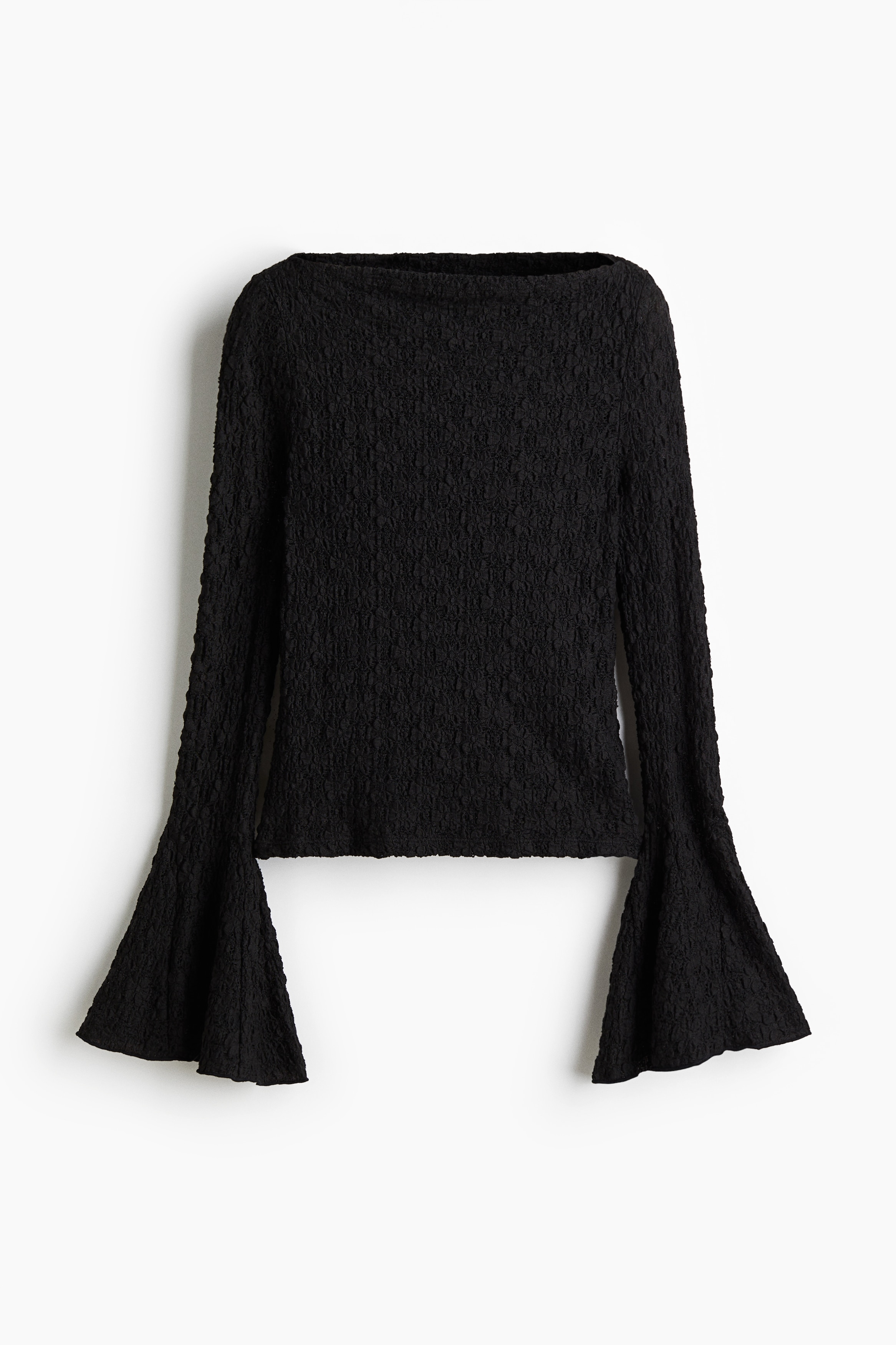 레이스 느낌의 피트되는 저지 탑. 섬세한 보트넥. 트럼펫 스타일의 긴소매. 스트레이트 헴라인. 이미지