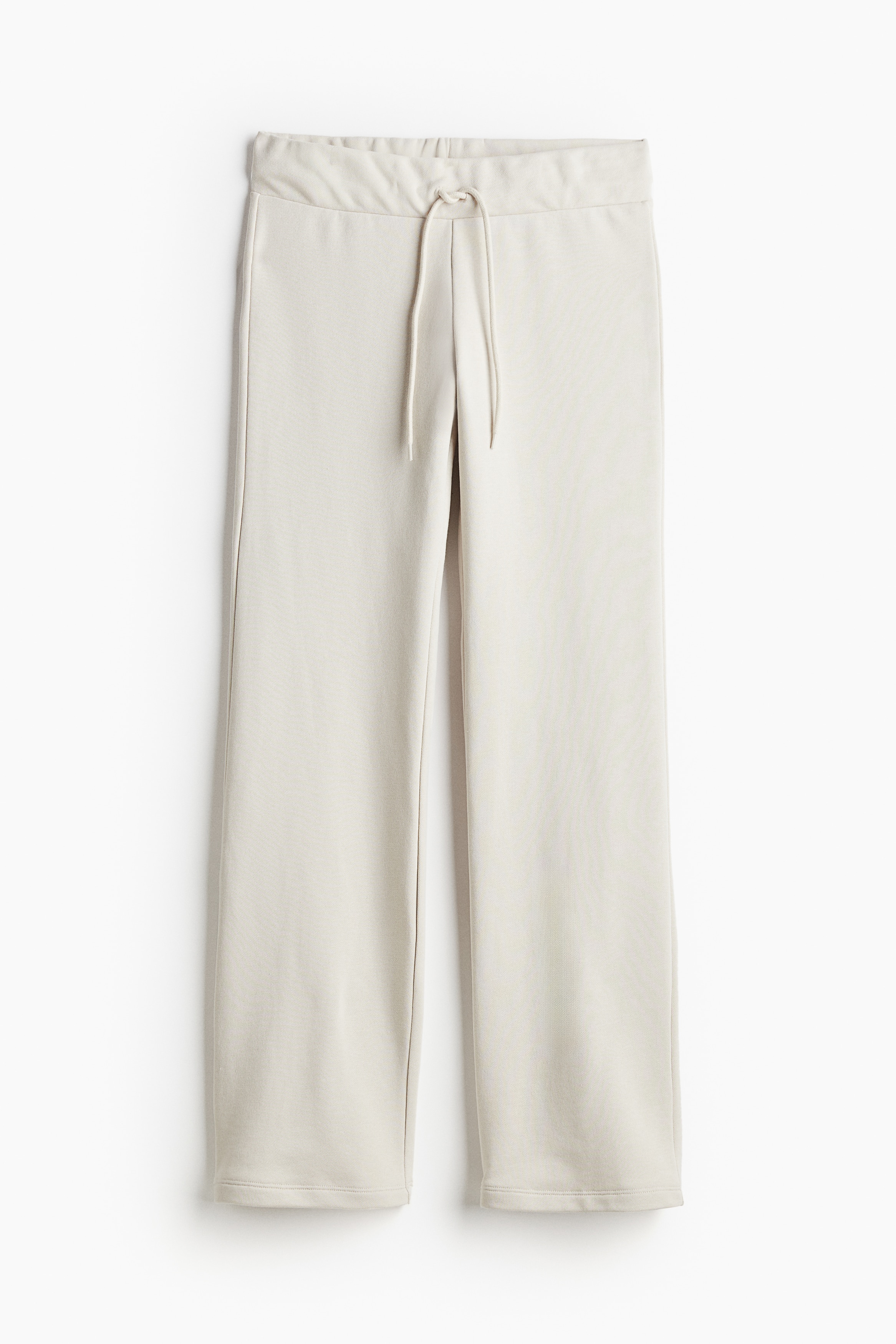 코튼이 혼방된 가벼운 스웨트셔츠 소재의 조거 팬츠. 드로스트링이 있는 허릿단. 스트레이트 레그. 이미지