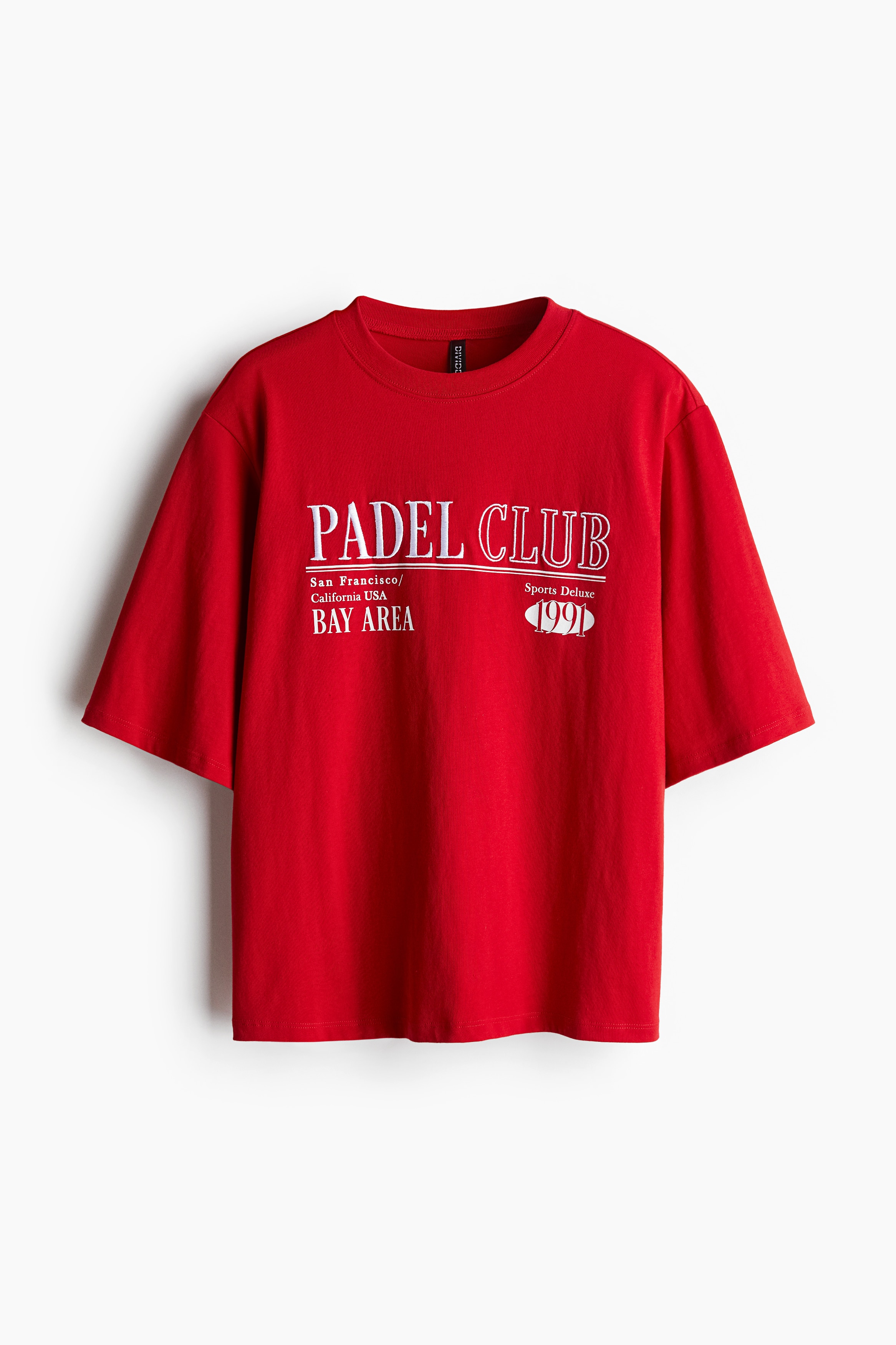 디자인이 있는 부드러운 코튼 저지 소재의 오버사이즈 티셔츠. 박시한 스타일. 리브드 네크라인. 드롭 숄더. 이미지