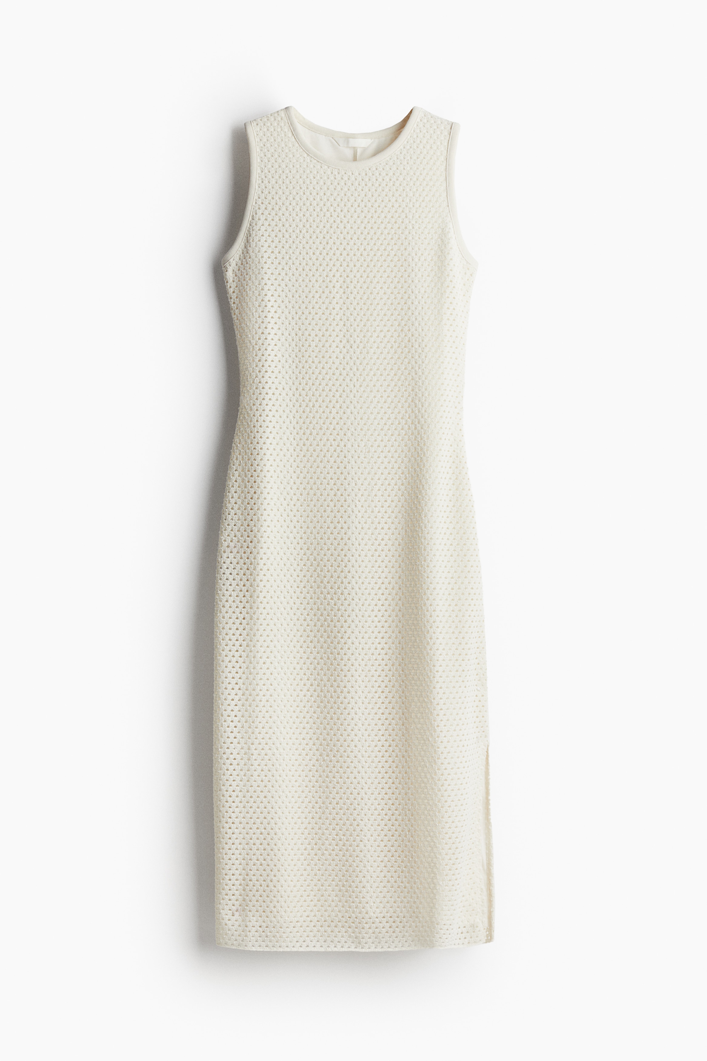 메쉬 소재의 슬리브리스 미디 원피스. 라운드넥. 한쪽 옆면에 긴 트임이 있는 스트레이트 헴라인. 저지 안감 부착. 이미지