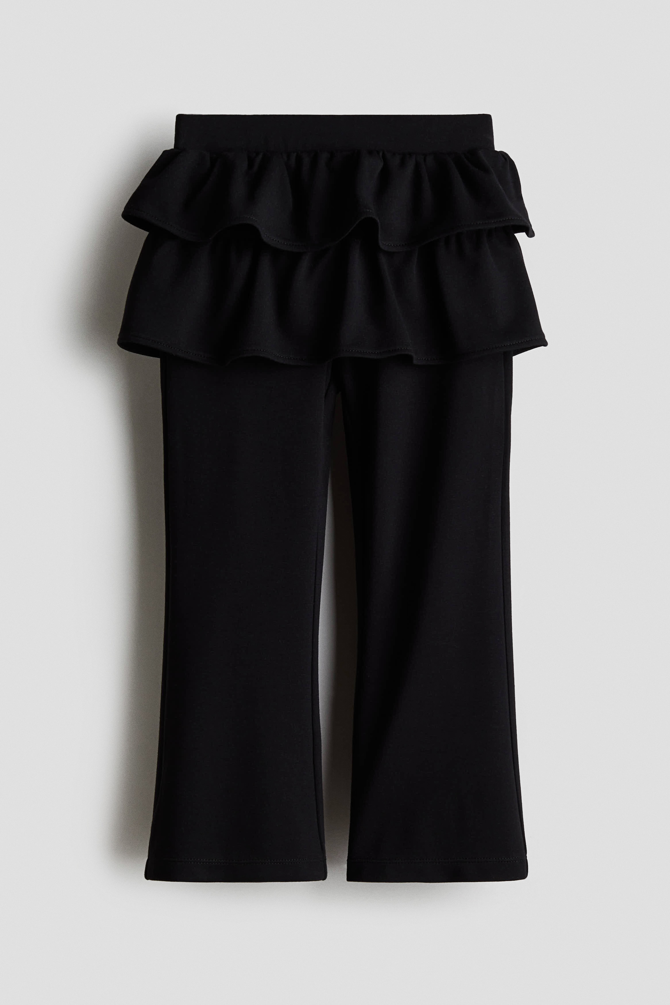 티어드 스커트가 부착된 부드러운 저지 소재의 레깅스. 밴딩으로 허리 사이즈 조절. 플레어 레그. 이미지