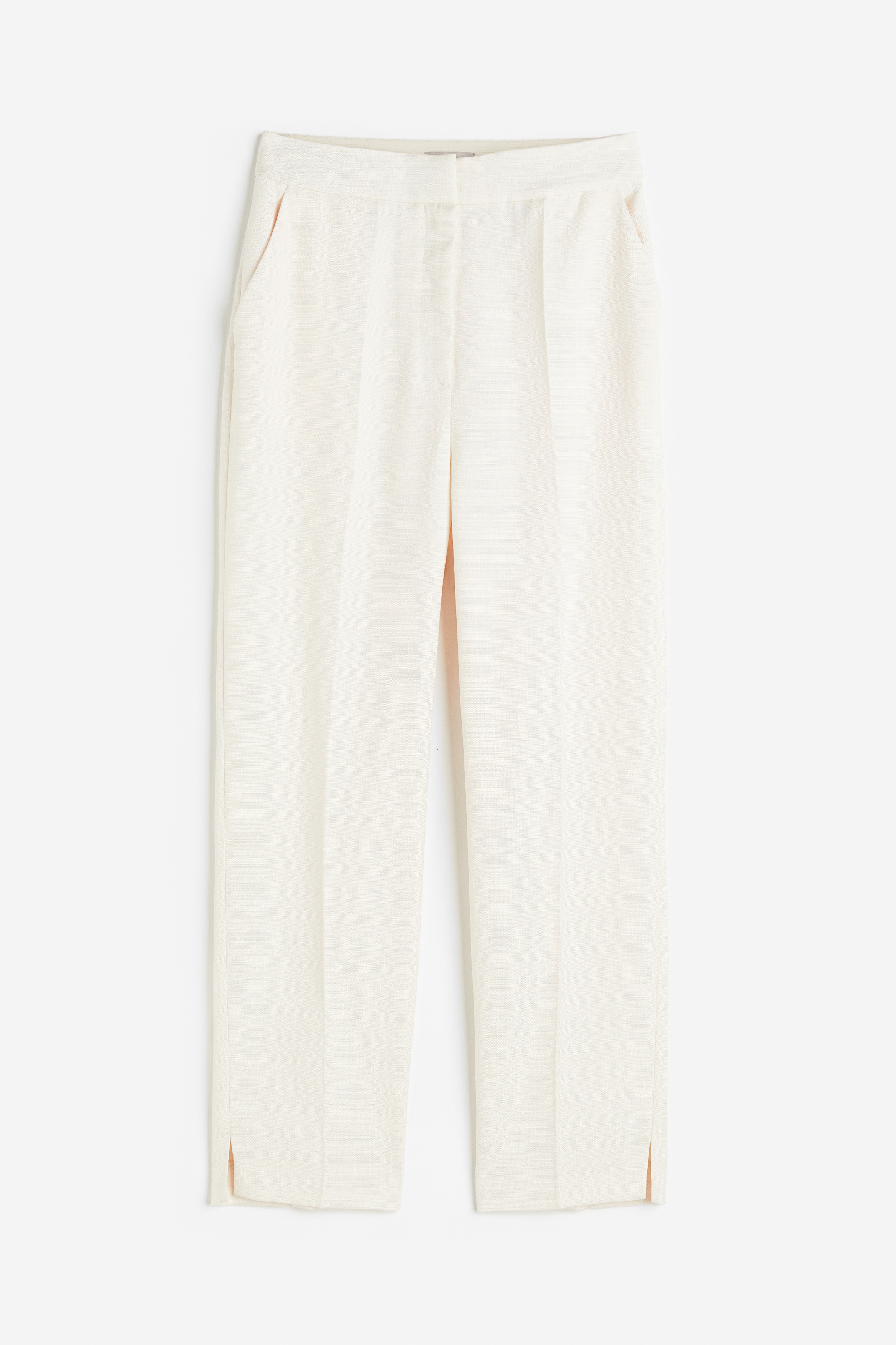 우븐 소재의 9부 테일러드 팬츠. 하이웨이스트. 히든 밴딩 허릿단. 후크와 지퍼 클로저. 사선 방향의 옆면 포켓. 뒷면 페이크 웰트포켓. 크리스가 잡힌 세미 테이퍼드 레그. 짧은 트임이 있는 아랫단. 이미지