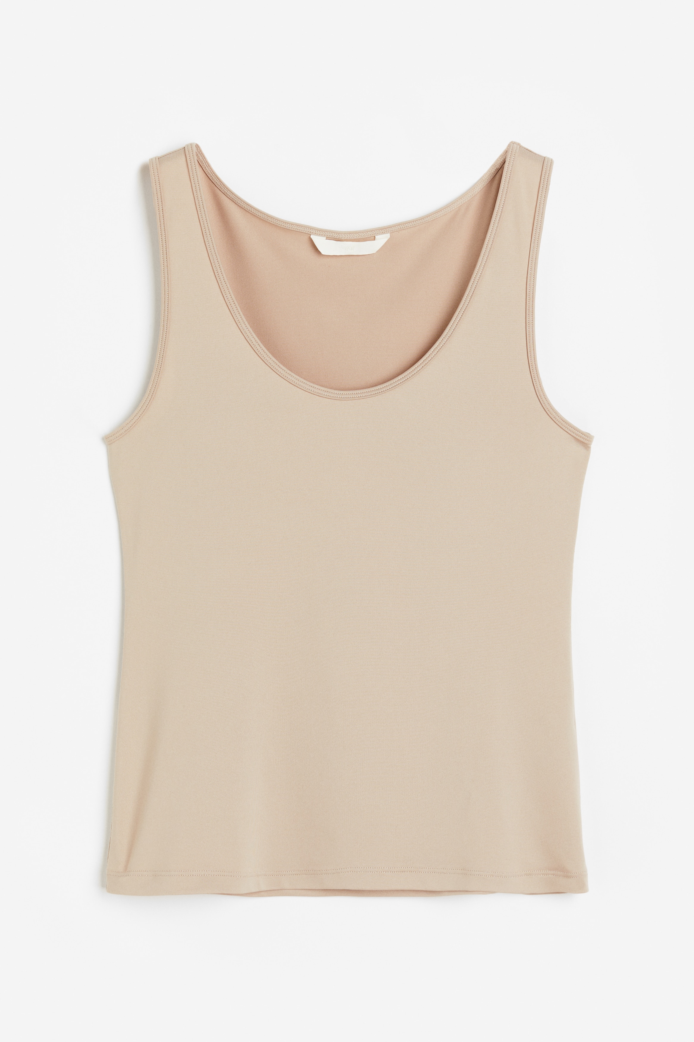 스트레치 저지 소재의 슬리브리스 탑. 깊에 파인 라운드넥. 수분 흡수와 온도 조절을 효율적으로 돕는 퀵드라이 폴리에스터를 사용해 부드럽고 편안한 기능성 COOLMAX® 소재. 이미지