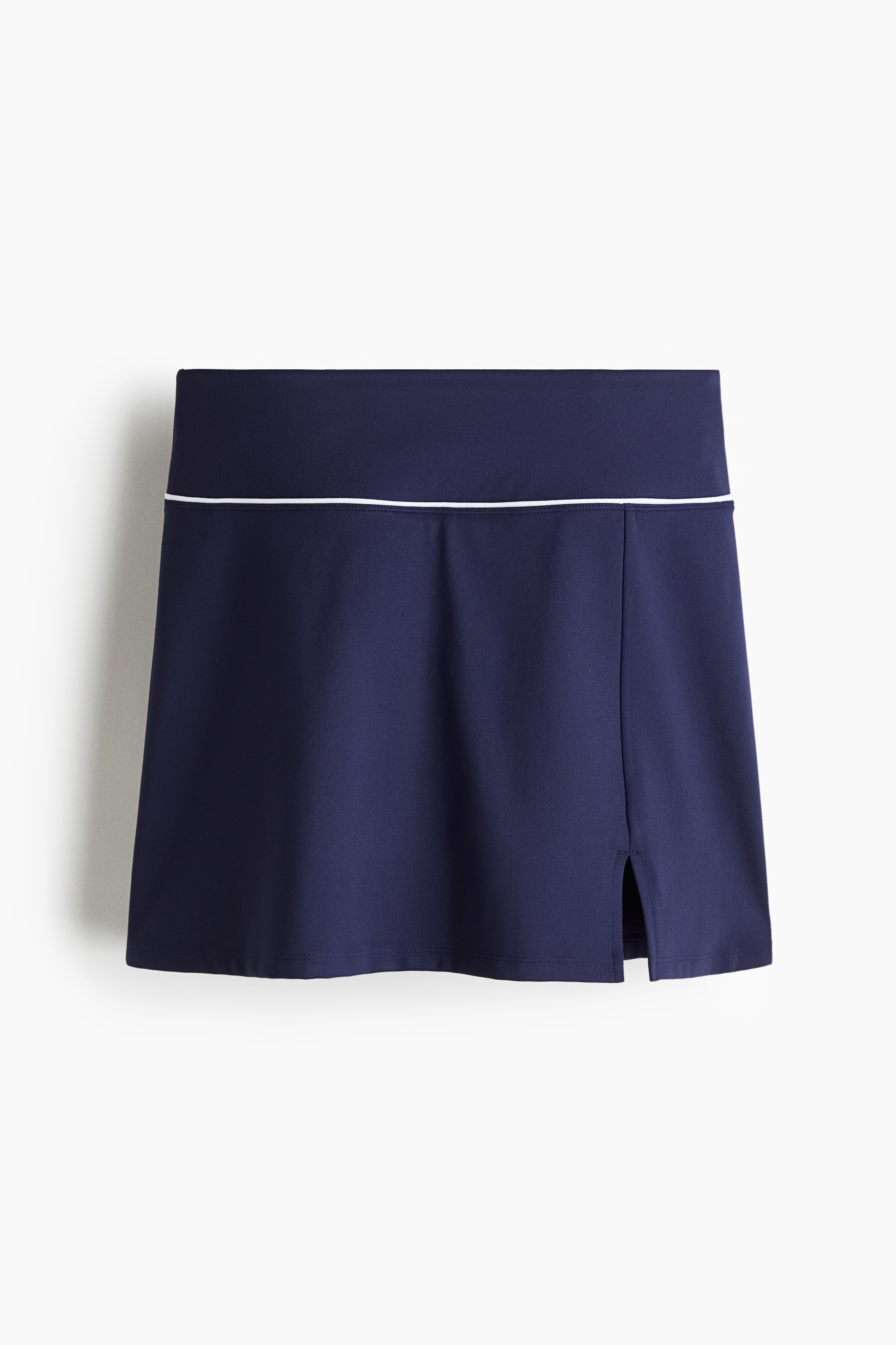 수분을 빠르게 흡수하여 편안하고 쾌적한 활동을 도와주는 기능성 DryMove™ 소재의 스포츠 스커트. 하이웨이스트. 신축성 허릿단. 한쪽 옆면 하단에 트임이 있음. 한쪽 다리 부분에 포켓이 있는 저지 핫팬츠 내장. 이미지