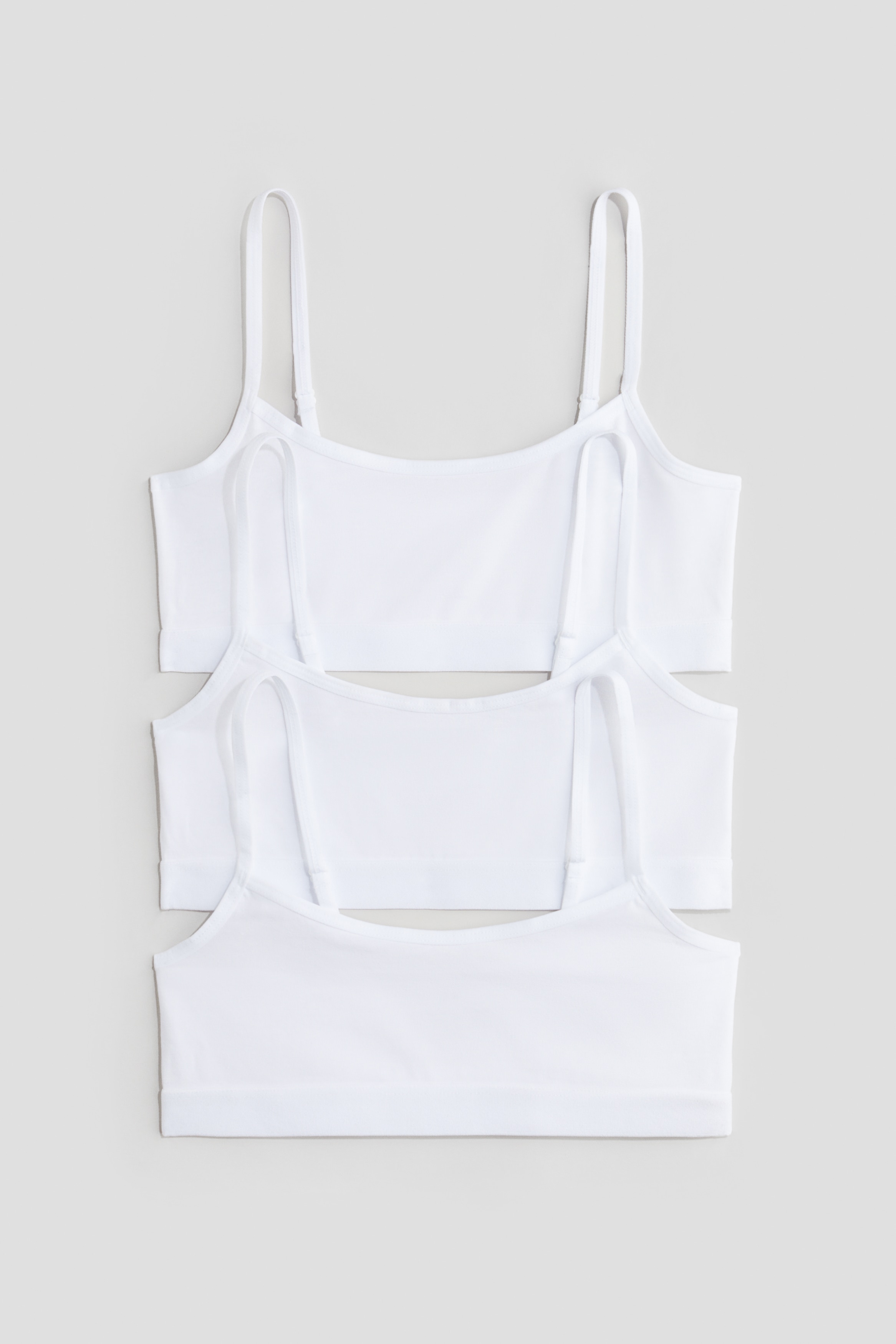 부드러운 저지 소재의 탑 세트. 길이 조절 가능한 가느다란 어깨 스트랩. 신축성 아랫단. 이미지1