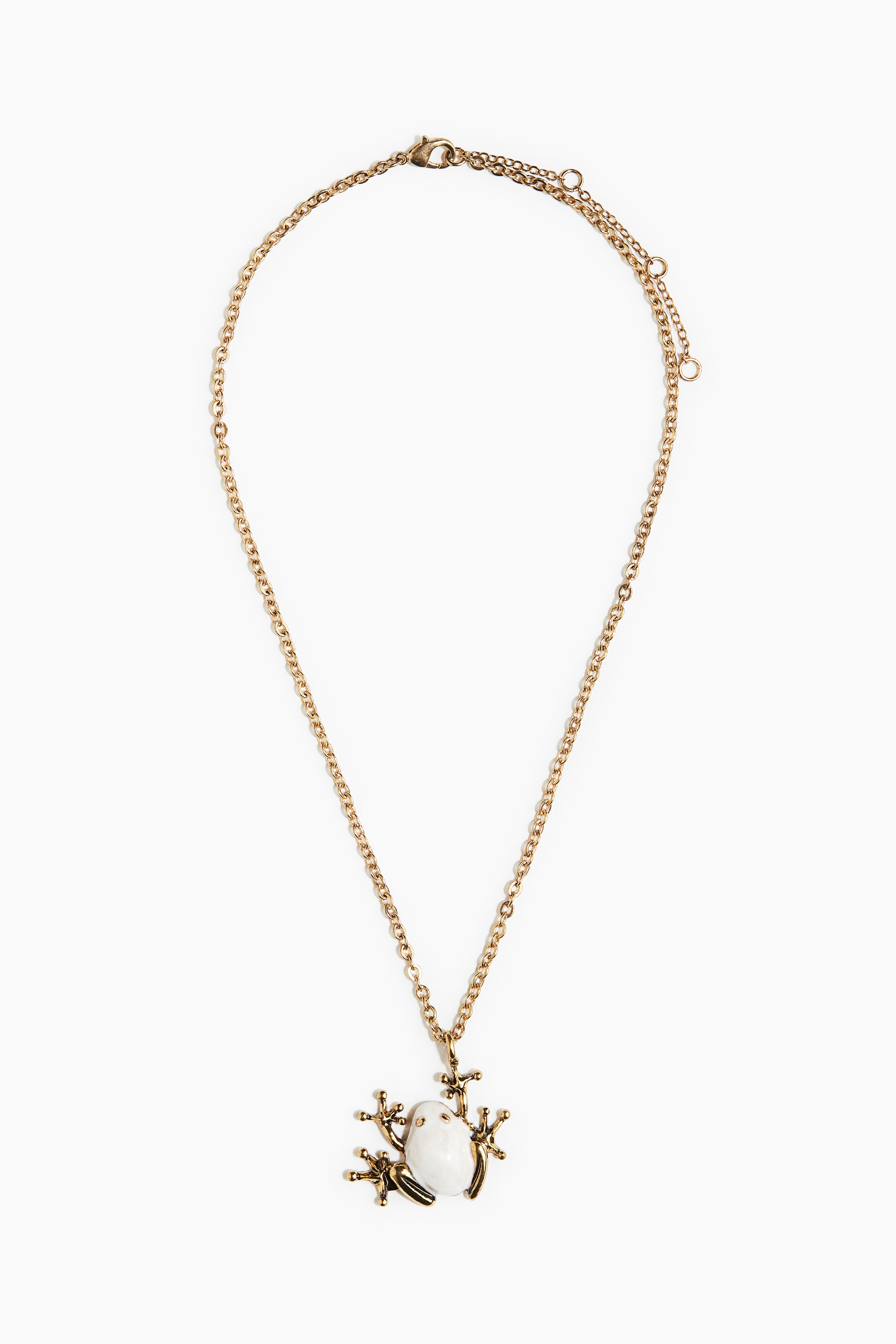 Metal chain necklace with a frog-shaped pendant. Adjustable length with a trigger clasp. 이미지