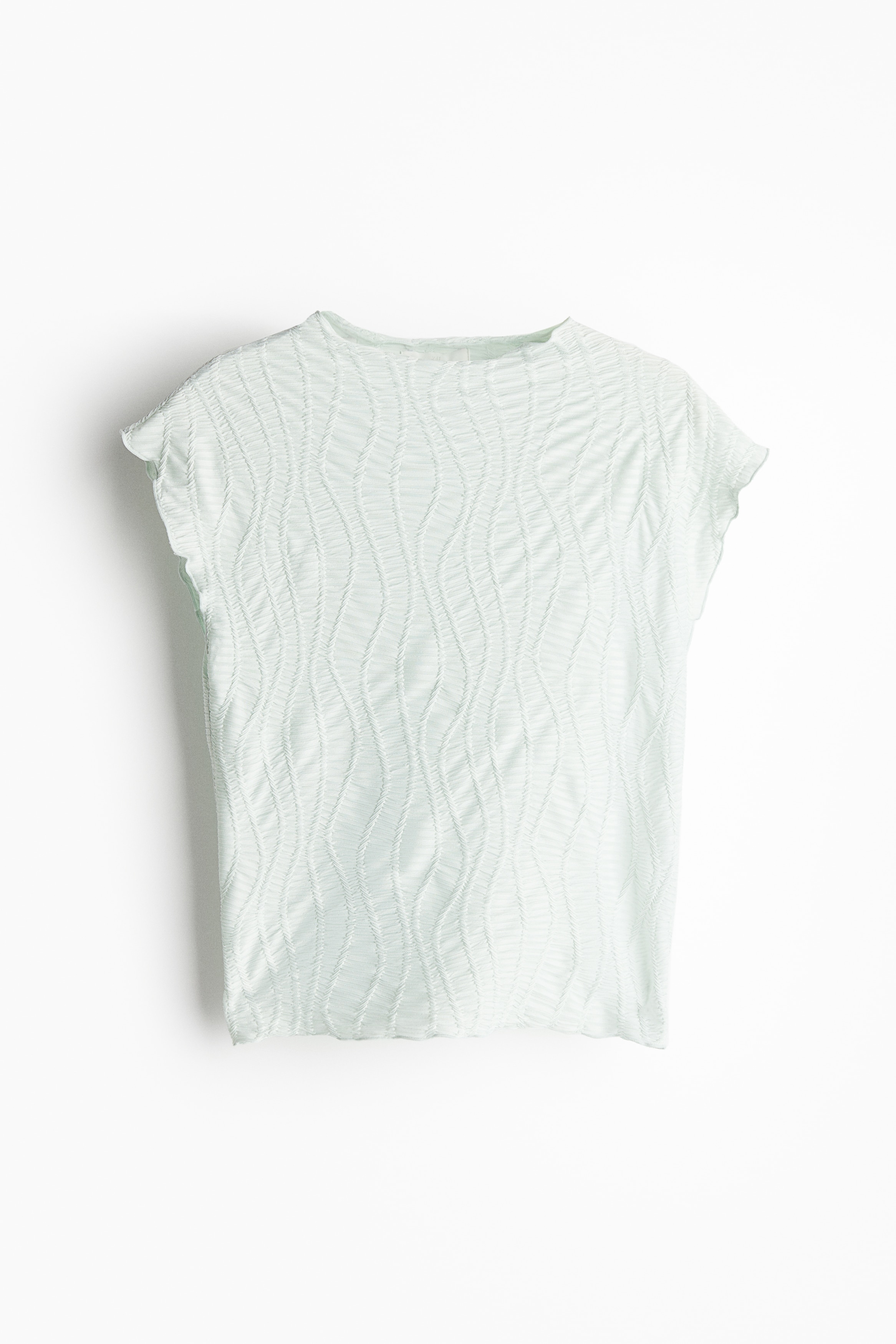 자카드 저지 소재의 피트되는 탑. 하프넥, 캡소매. 오버로크처리된 옷단. 이미지