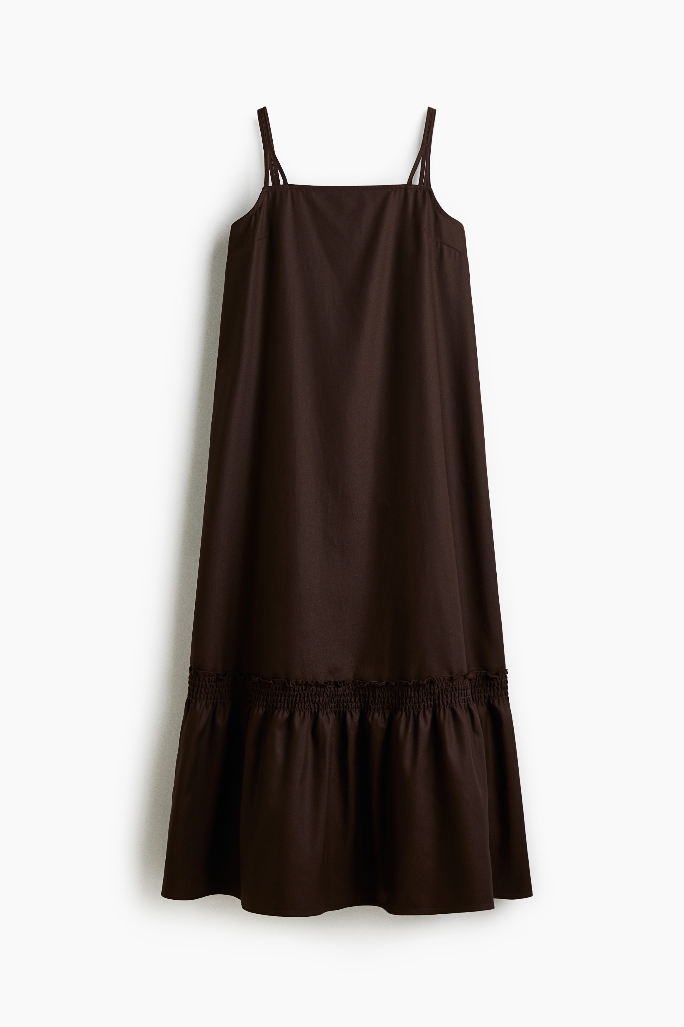 리오셀과 코튼이 혼방된 트윌 소재의 미디 드레스. 스트레이트 네크라인. 가는 더블 어깨 스트랩. 하단의 스모킹 주름 디테일로 풍성함을 더한 실루엣. 안감 생략. 이미지