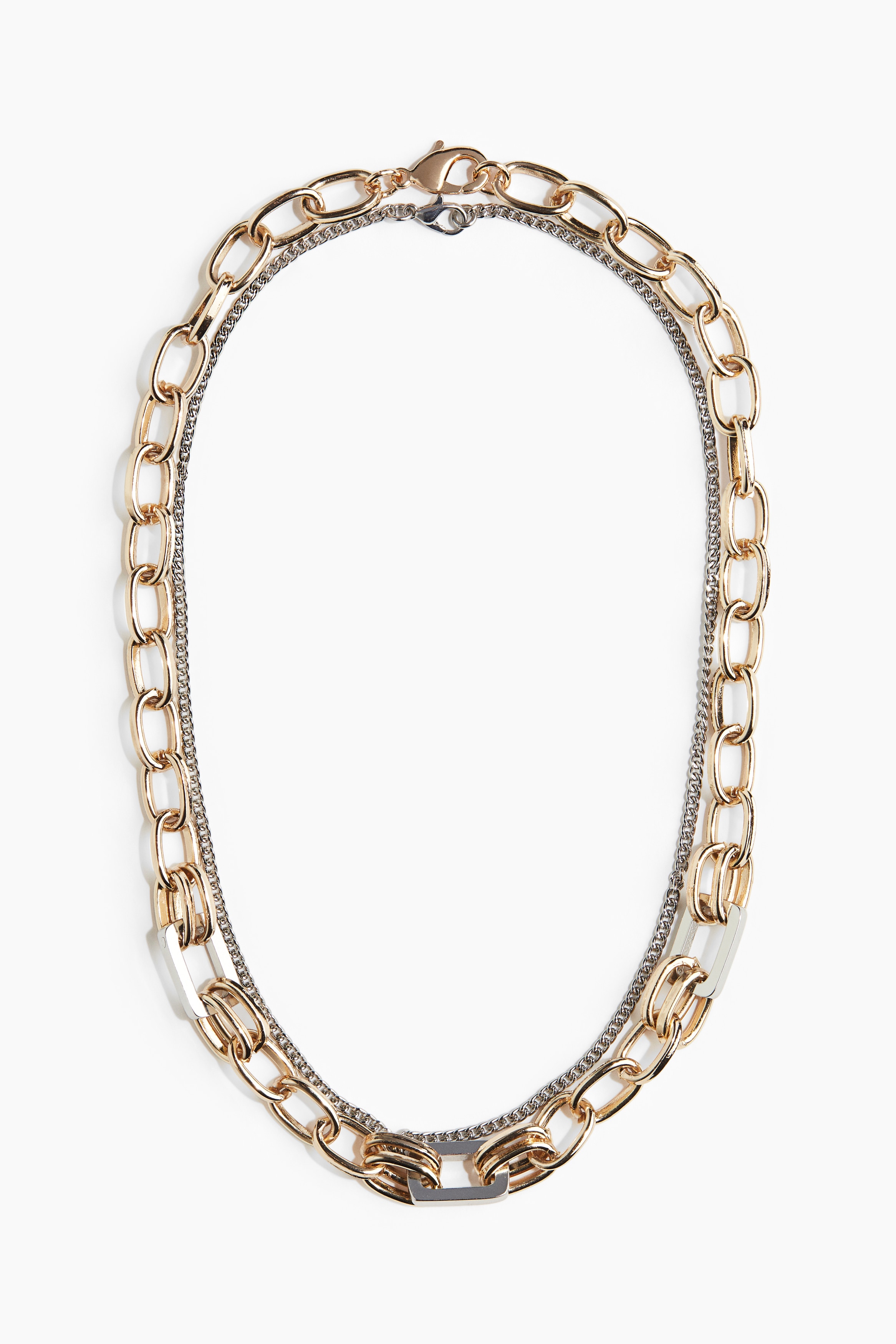 함께 또는 개별 착용할 수 있는 서로 다른 디자인의 금속 목걸이 세트. 트리거 후크 클로저. 이미지