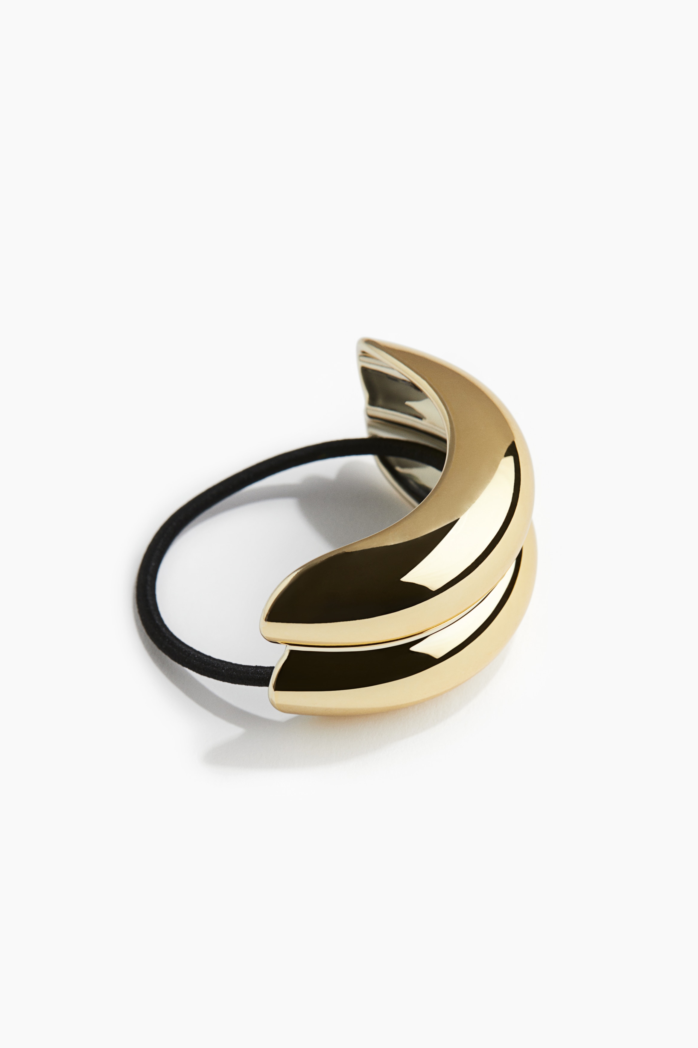 포니테일을 고급스럽게 마무리해 주는 메탈릭 코팅 플라스틱 장식의 머리끈. 이미지