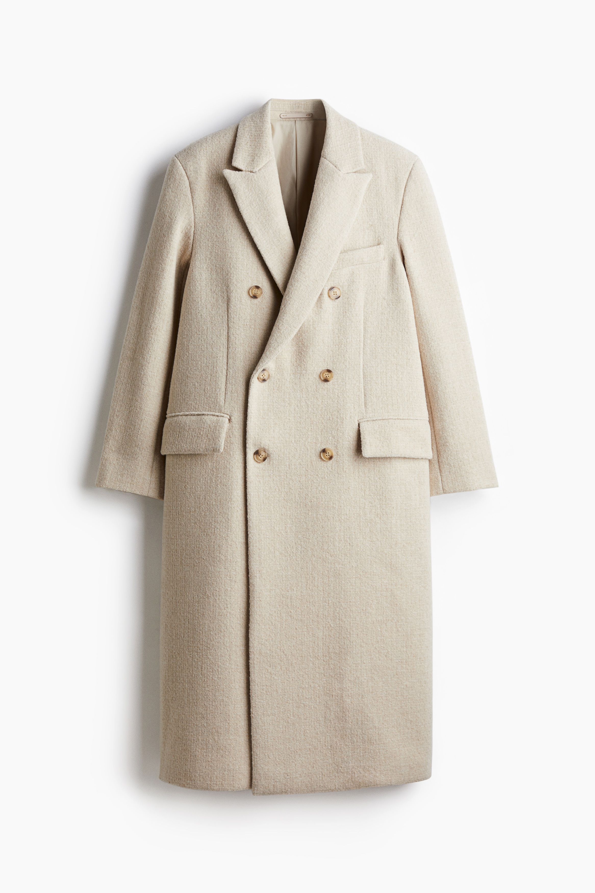 울이 혼방된 부드러운 펠트 소재의 긴소매 롱 코트. 더블 브레스티드 스타일. 피크트 라펠. 앞면 플랩포켓. 내부 웰트포켓. 뒷트임. 착용감이 편안하고 클래식한 레귤러핏 실루엣. 안감 부착. 이미지