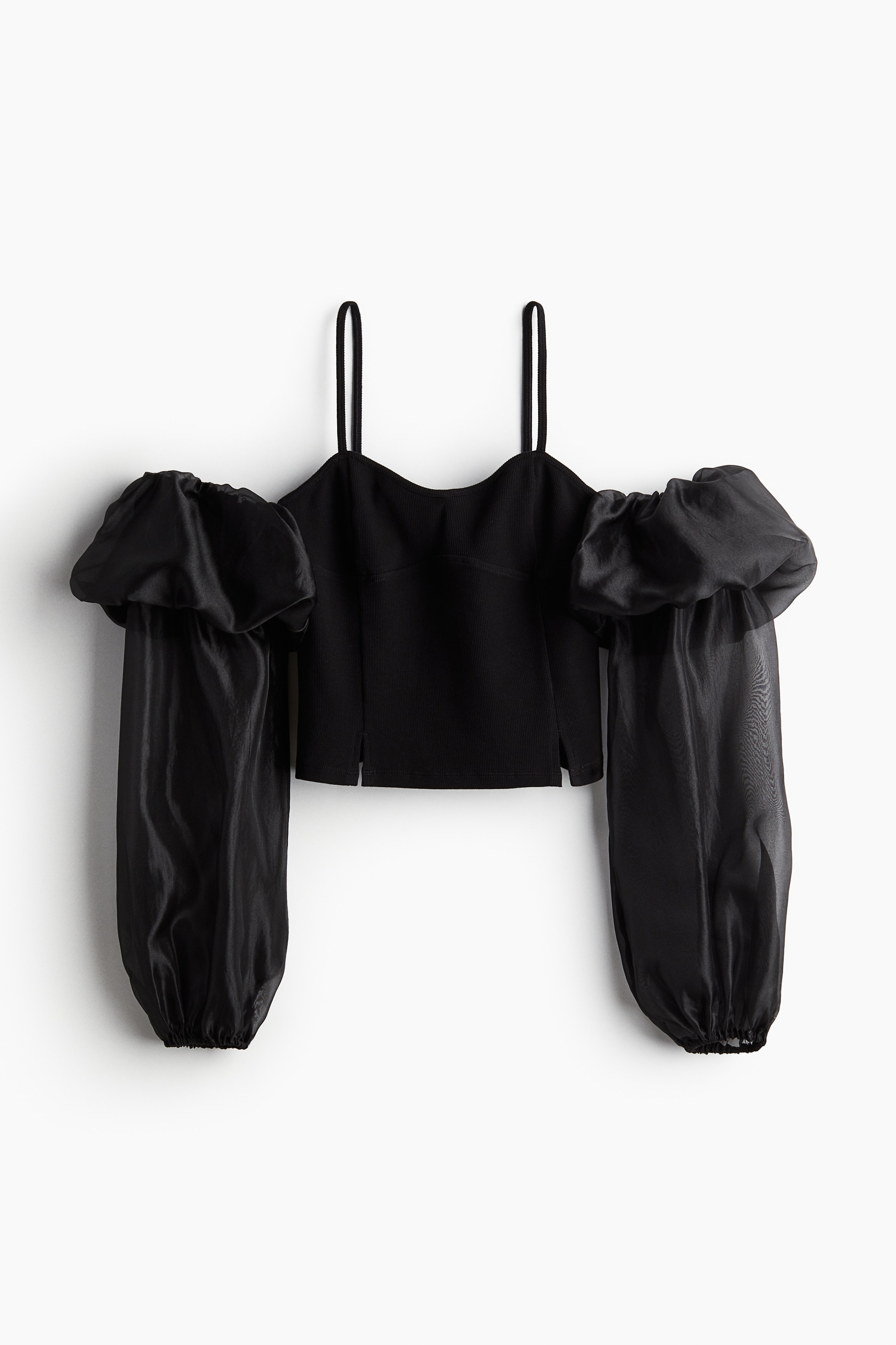 리브드 코튼 저지 소재의 피트되는 컷아웃 숄더 탑. 가느다란 어깨 스트랩. 스위트하트 네크라인. 트임으로 마무리되는 앞면 솔기. 비침성 있는 소재로 마감된 벌룬 스타일의 긴소매. 소매 상단이 풍성하게 처리됨. 밴딩이 내장된 소맷단. 이미지