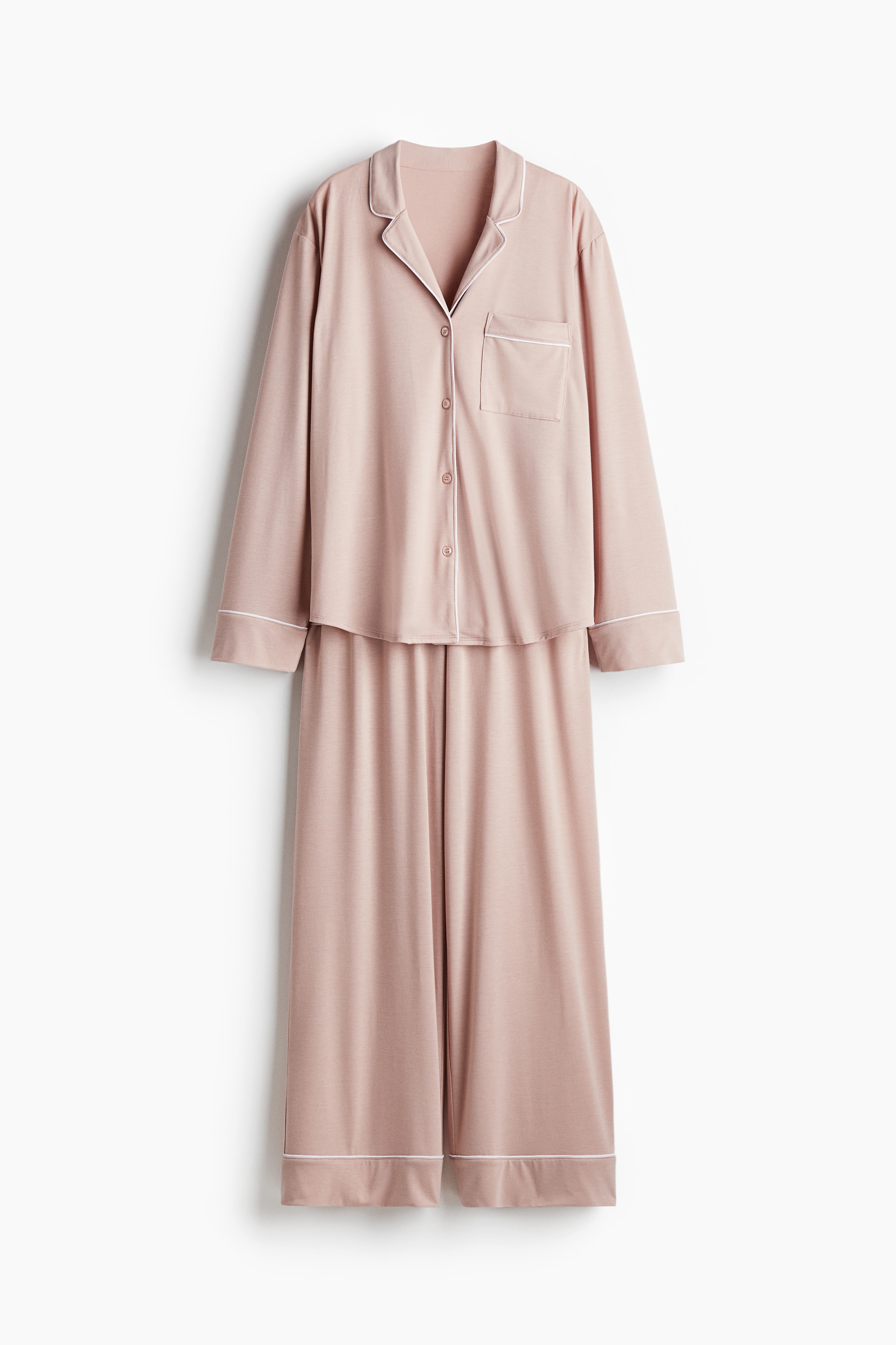 부드러운 비스코스 저지 소재의 긴소매 셔츠와 팬츠로 구성된 파자마 세트. 셔츠 - 노치트 라펠. 버튼업 스타일. 팬츠 - 신축성 허릿단. 와이드한 스트레이트 레그. 이미지