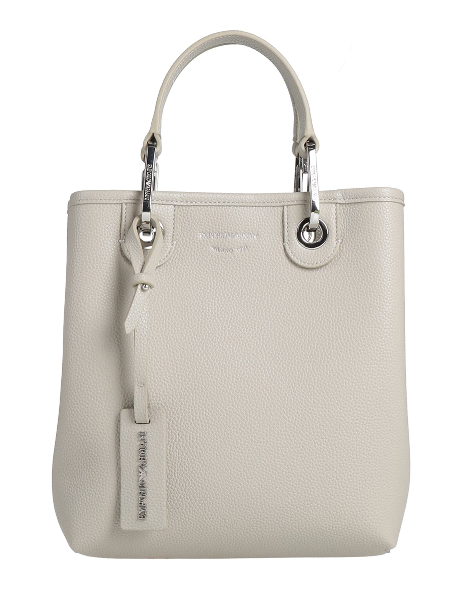 버킷백, 인조가죽, 솔리드 컬러, 브랜드 로고, 마그네틱 클로져, 안감 처리한 내부, 내부 지퍼 포켓, 더블 핸들, 탈착가능 숄더 스트랩, 미디엄 스타일. 이미지