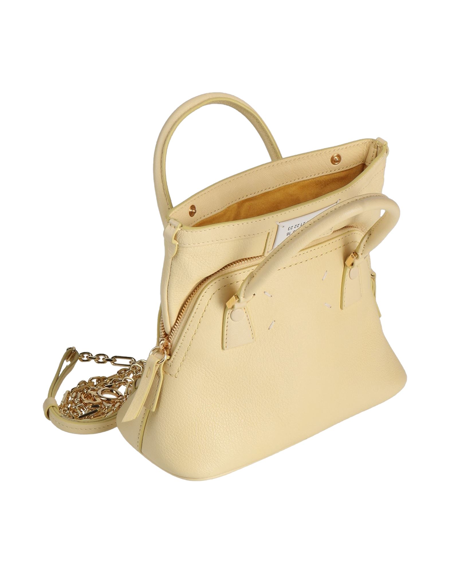 미디엄 스타일, 텍스쳐드 가죽, 브랜드 로고, 솔리드 컬러, 지퍼 여밈, 스냅버튼 여밈, 안감있음, 내부 포켓, 더블 핸들, 탈착가능 숄더 스트랩, 메탈 스트랩, 스터드 장식 바닥, 동물성 비섬유 자재 함유, 사첼백. 이미지