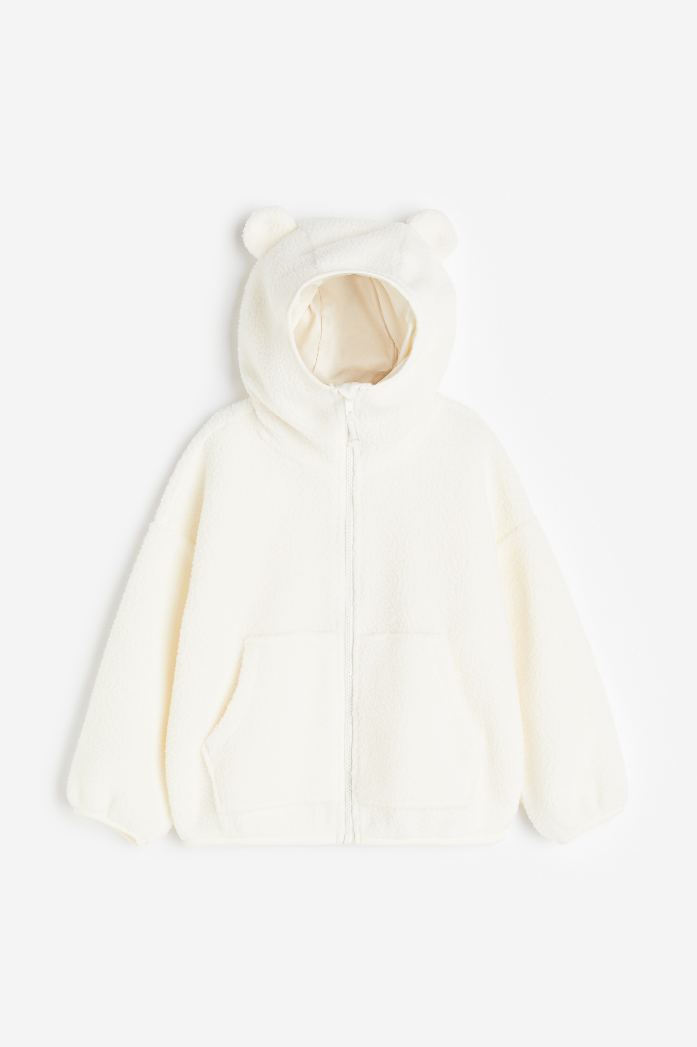 부드러운 파일 소재의 오버사이즈 재킷. 신축성 있게 마감된 저지 트리밍. 저지 안감과 귀 모양 아플리케 장식이 있는 후드. 턱부분 에 쓸림 방지 덮개가 있는 지퍼 클로저. 드롭 숄더. 긴소매. 앞면 캥거루 포켓. 이미지