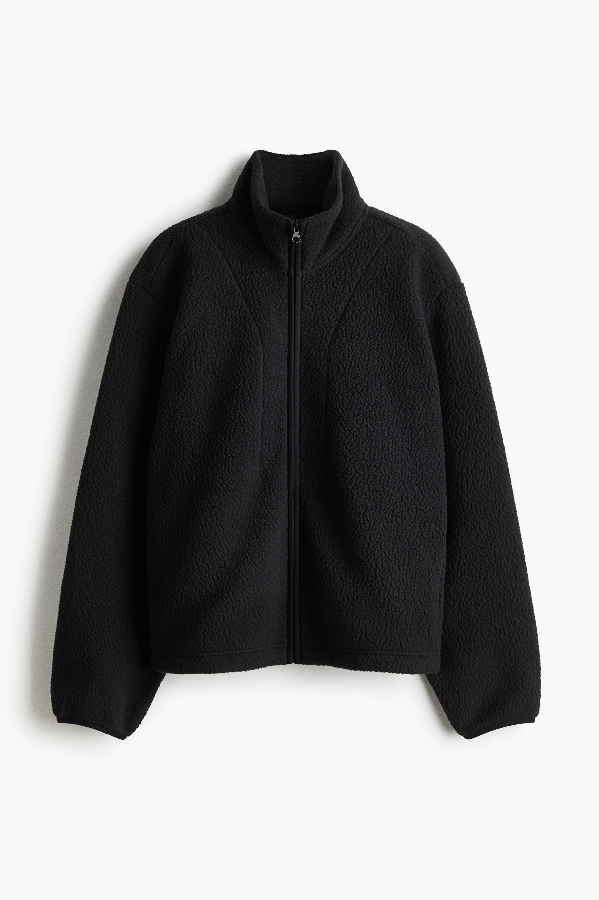 Sports jacket in soft, warming teddy. Loose fit with a stand-up collar, zip down the front, and welt side pockets with a zip. Long sleeves with narrow elastication at the cuffs, and a concealed, elasticated drawstring with cord stoppers at the hem. Unlined. 이미지