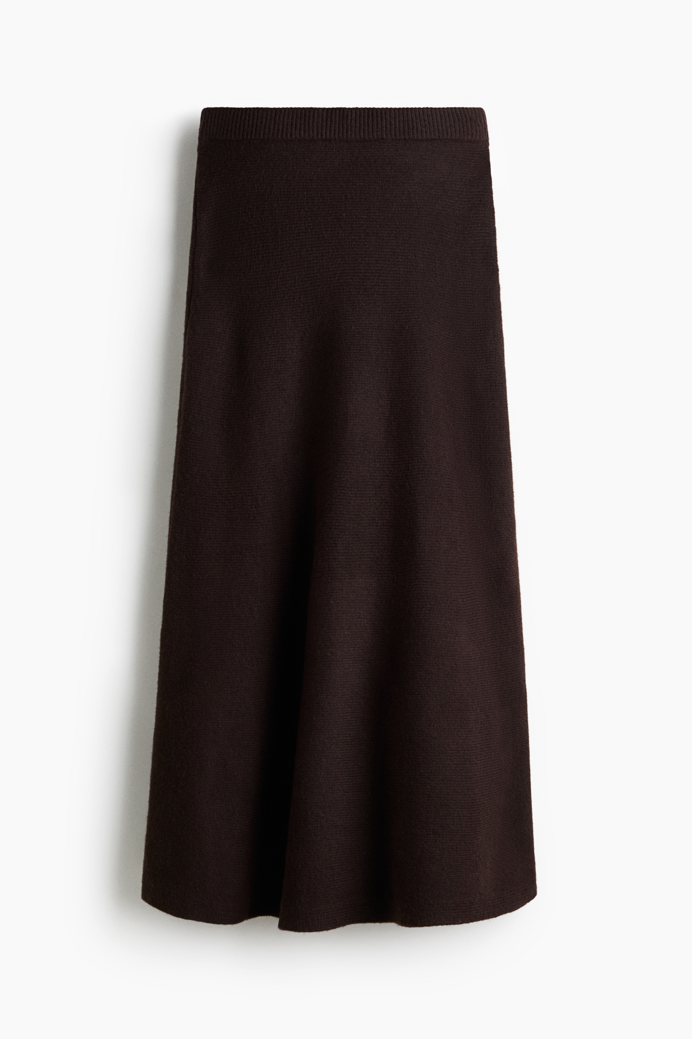 부드러운 니트 소재의 롱 스커트. 하이웨이스트. 신축성 허릿단. 플레어 라인. 이미지