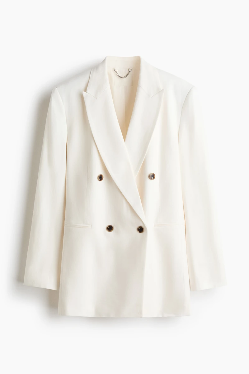Long, oversized blazer in woven fabric made from a linen and viscose blend. Featuring peak lapels, a double-breasted front and jetted front pockets. Thin shoulder pads and sleeves with kissing buttons at the cuffs. Double back vent. Lined. 이미지1
